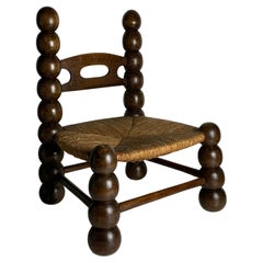 Wood Turned Bobbin Low Rush Chair in the style of Charles Dudouyt, France, 1950s