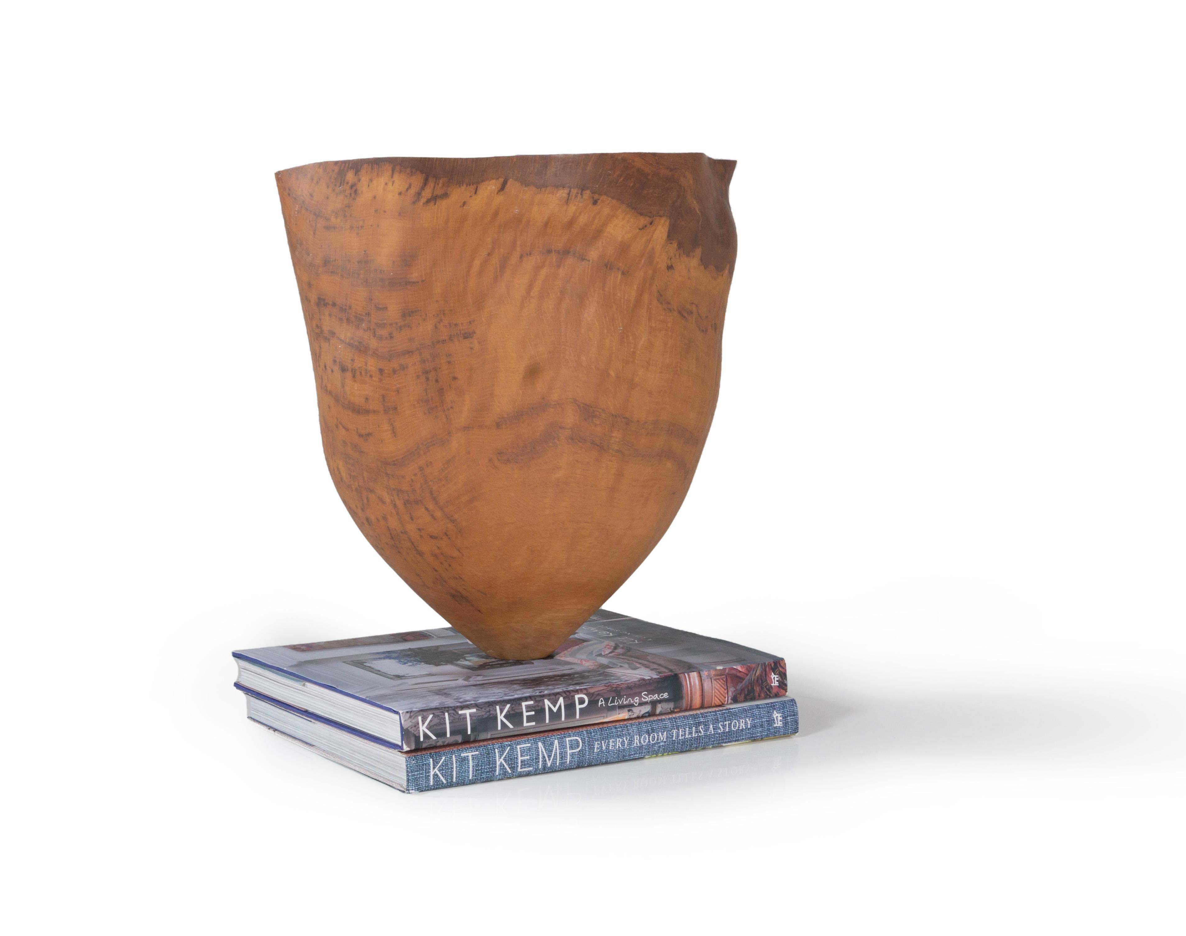 Transform your home or office into a place of calm and tranquility with this burr oak Wood Vessel by Anthony Bryant. This organically shaped bowl’s narrow base and wide opening are accentuated by its turned wood construction, while its organic shape