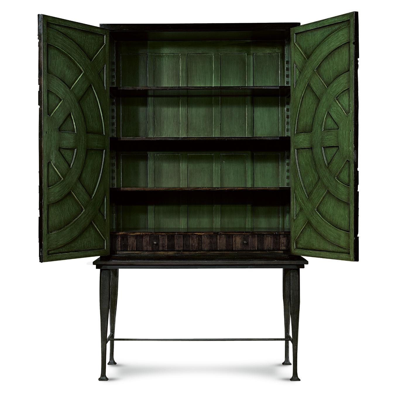 Inspired by a jet turbine, the Villiers armoire has 1300 hand-applied pieces that decorate its doors, giving it its emblematic textured finish. Its distinct iron base has been cast in a mold to get its tapered shape and it is forged on-site in our