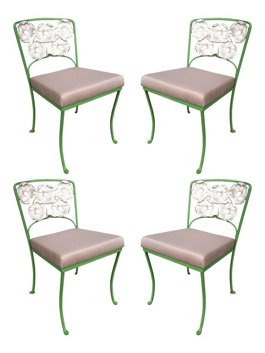 This set is very rare by Woodard it is an Aluminum outdoor/patio set that includes both tables with chairs with a distinct polished Aluminum floral pattern backrest and table decor. This set was constructed with solid core iron castings and is