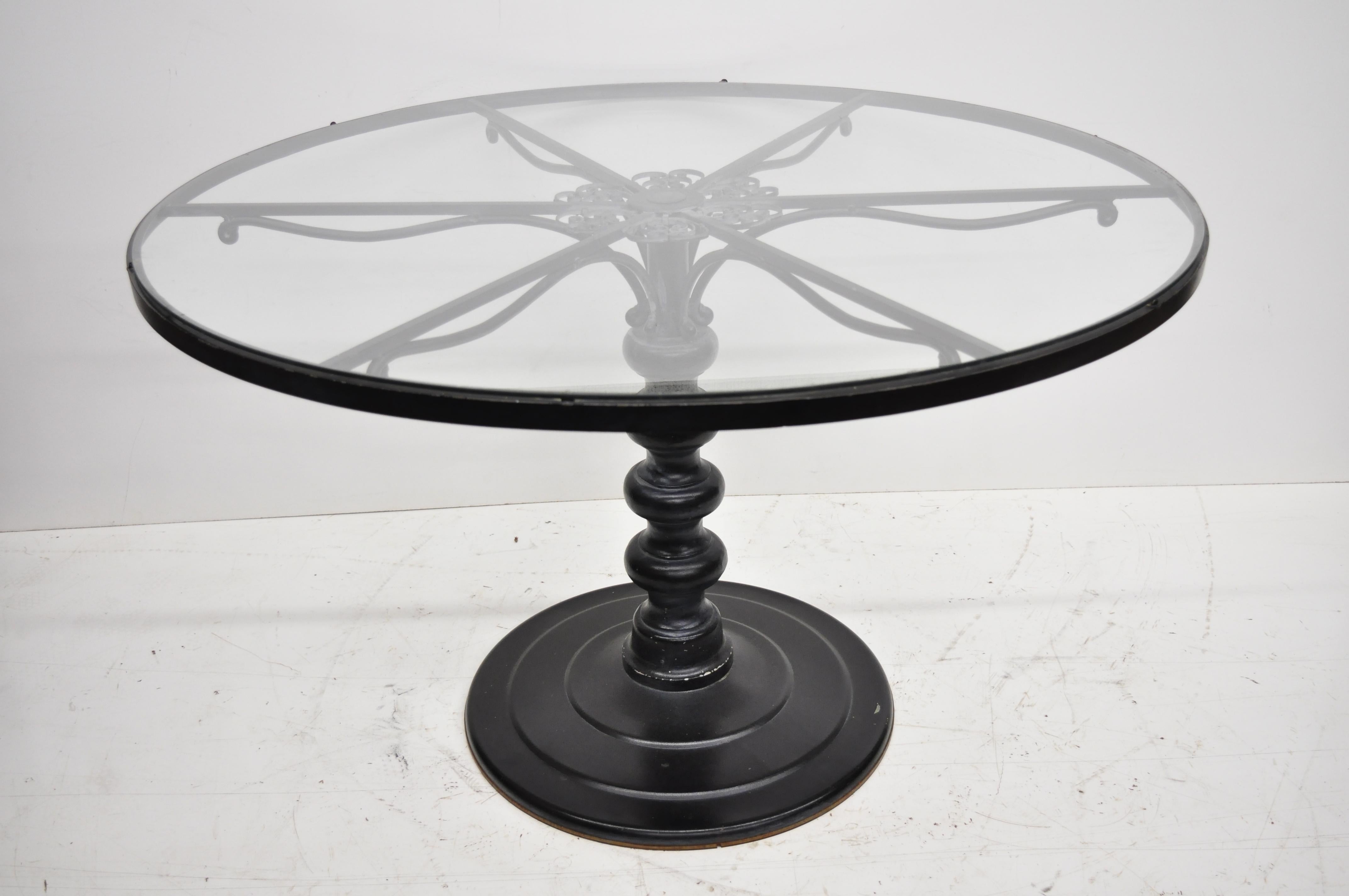 Woodard Andalusian wrought iron patio dining set round table 4 chairs. Listing includes round pedestal base dining table with glass top, 4 dining chairs, removable orange vinyl cushions, fancy scrolling frames, original label, and quality American