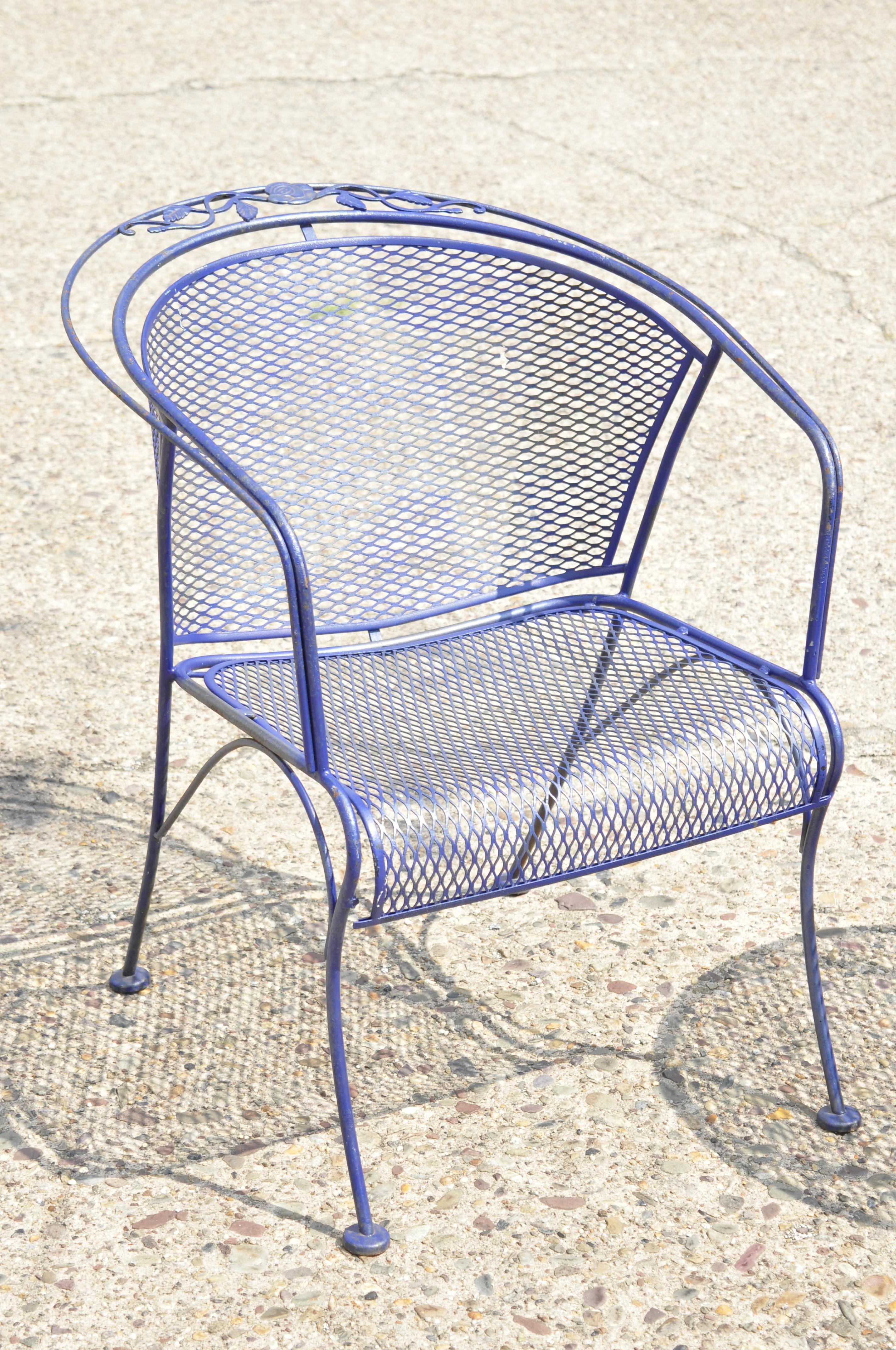 20th century Woodard barrel back blue wrought iron rose pattern garden armchairs and side table set. Set includes (2) armchairs, (1) round side table, mesh tops, wrought iron construction, original label, very nice vintage set, circa mid-late 20th