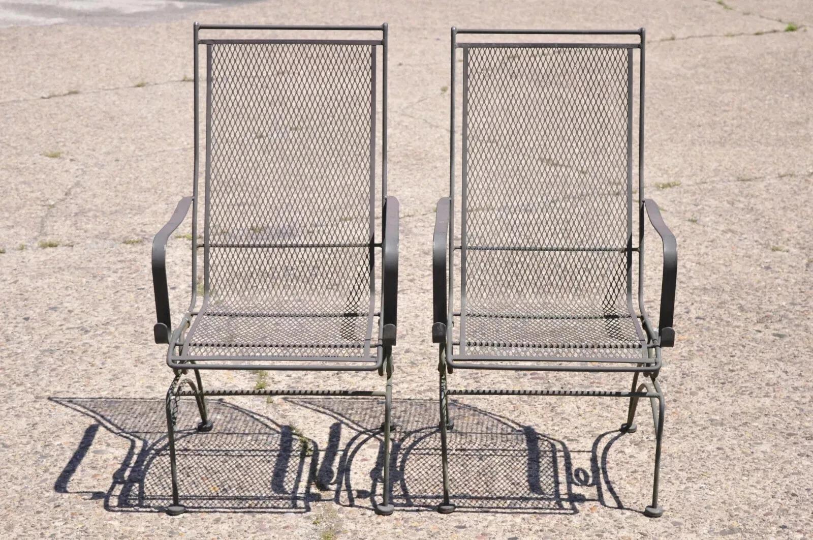 Woodard Bradford Collection Spring High Back Wrought Iron Patio Chairs - a Pair. Item features tall backs, coil spring base, wrought iron construction, quality American craftsmanship, great style and form. Circa Late 20th Century. Measurements: