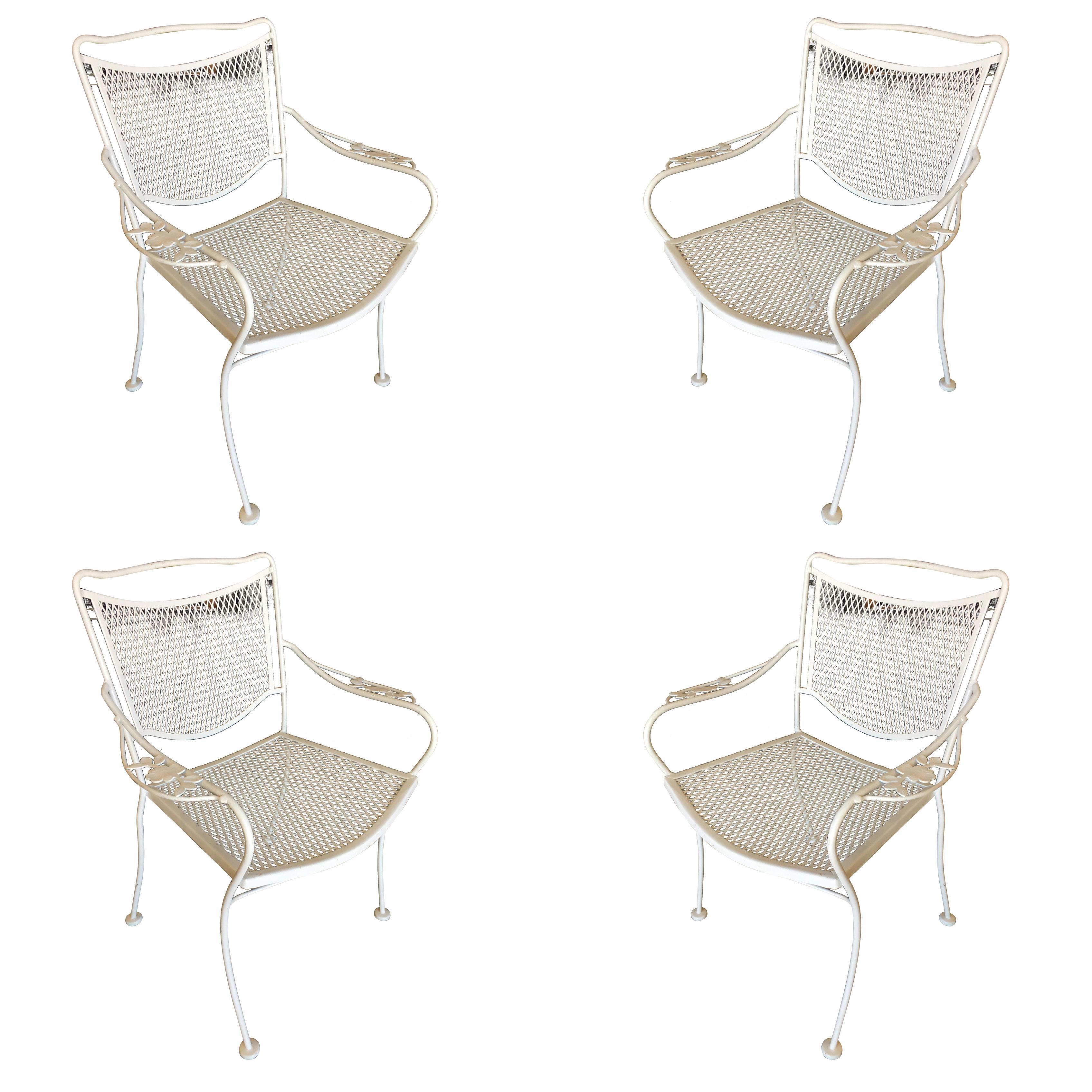 Set of four Russell Woodard designed wireframe outdoor patio chairs with leaf pattern arms and mesh steel seats. Please inquire us if you would like a different quantity of chairs. More are available upon request. All outdoor furniture can be
