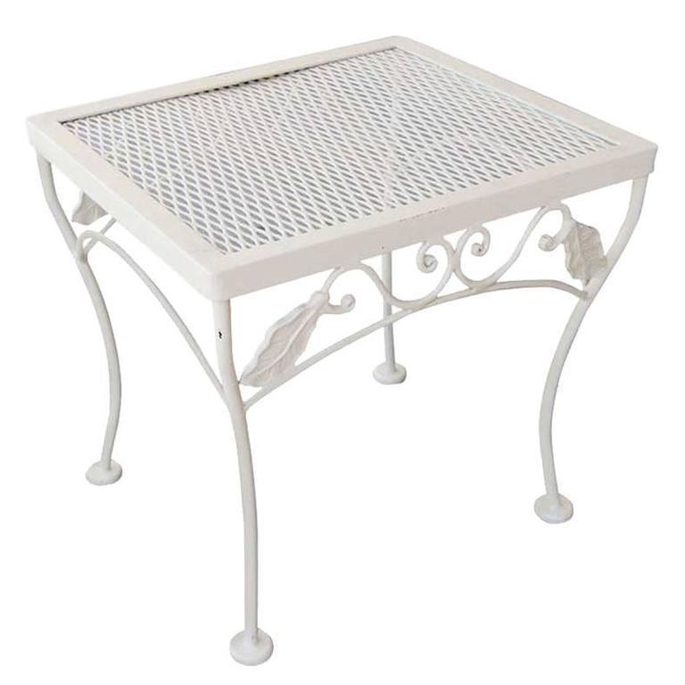 Vintage Outdoor/Patio side table with iron scrolling base and steel mesh top by the Woodward company. Table has been repainted in your choice of teal or white.

circa 1950, USA by Woodard.

Condition-Excellent- This table has been repainted to