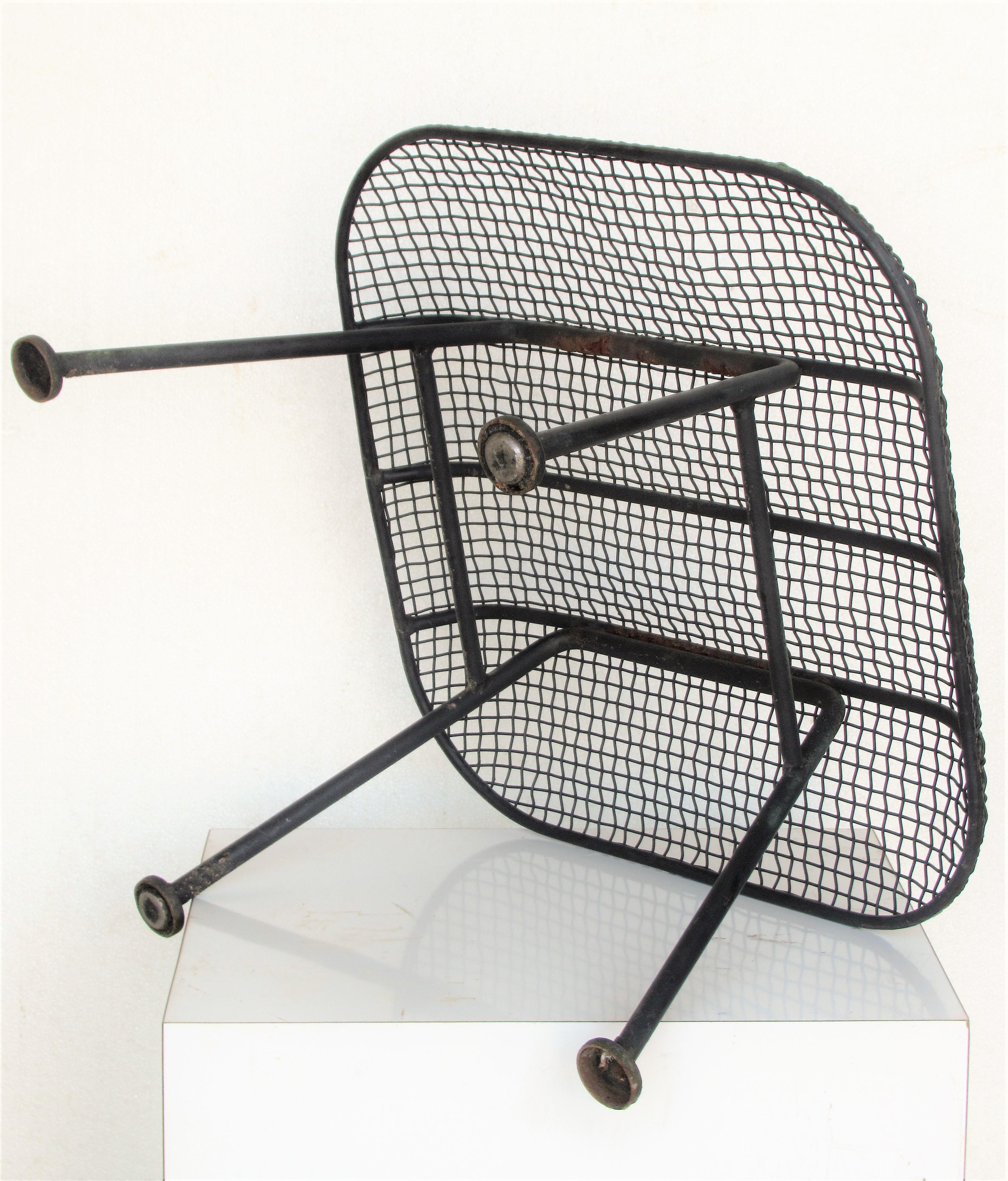  Sculptura iron mesh ottoman by Russell Woodard in nicely aged original old black painted surface - circa 1950's. Measures: 21 inches wide x 21 inches deep x 14 inches high and 25 inches across diagonally at seat  top. Look at all pictures and read