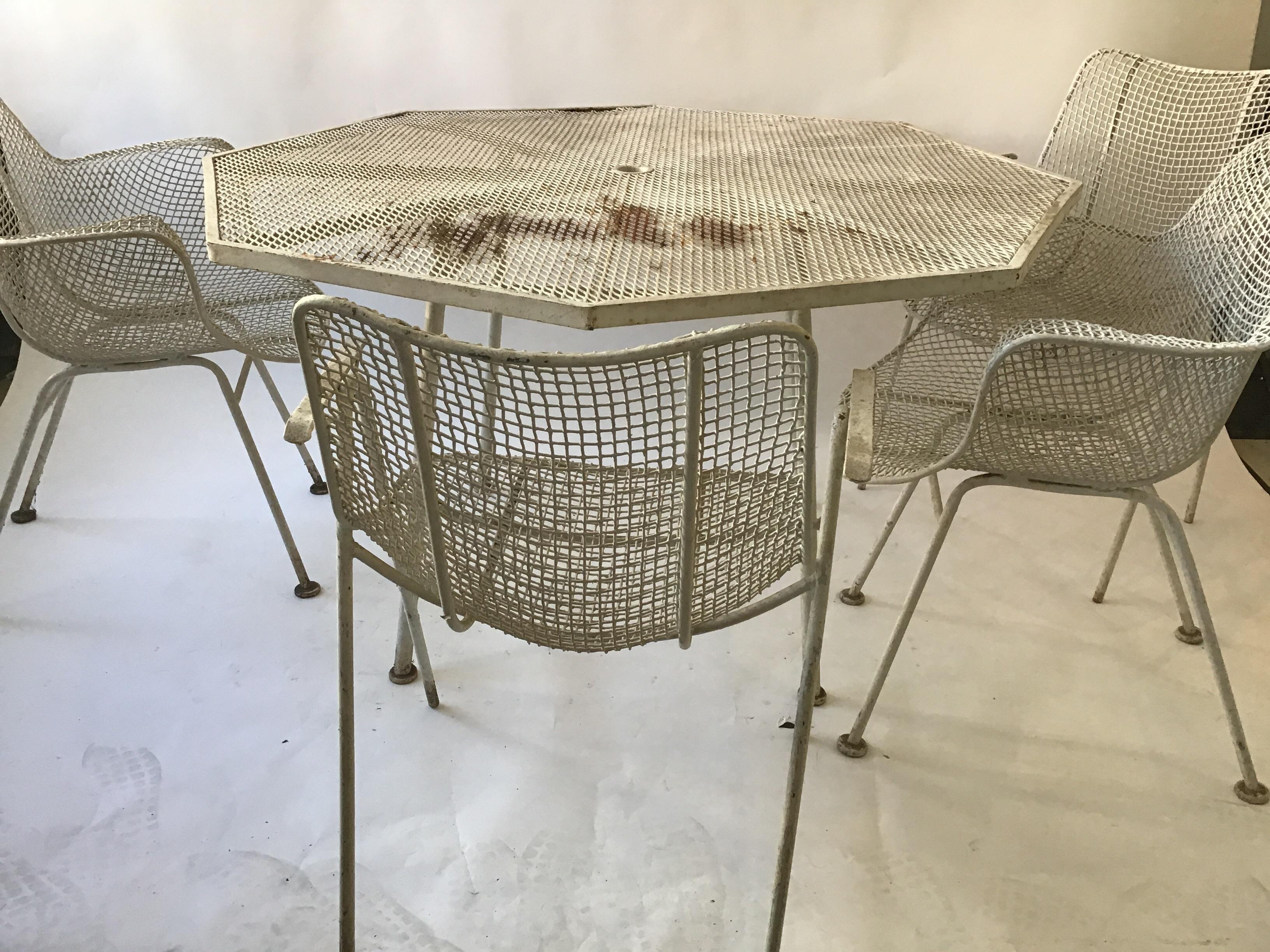 Russell Woodard iron patio set. Table and 4 chairs.