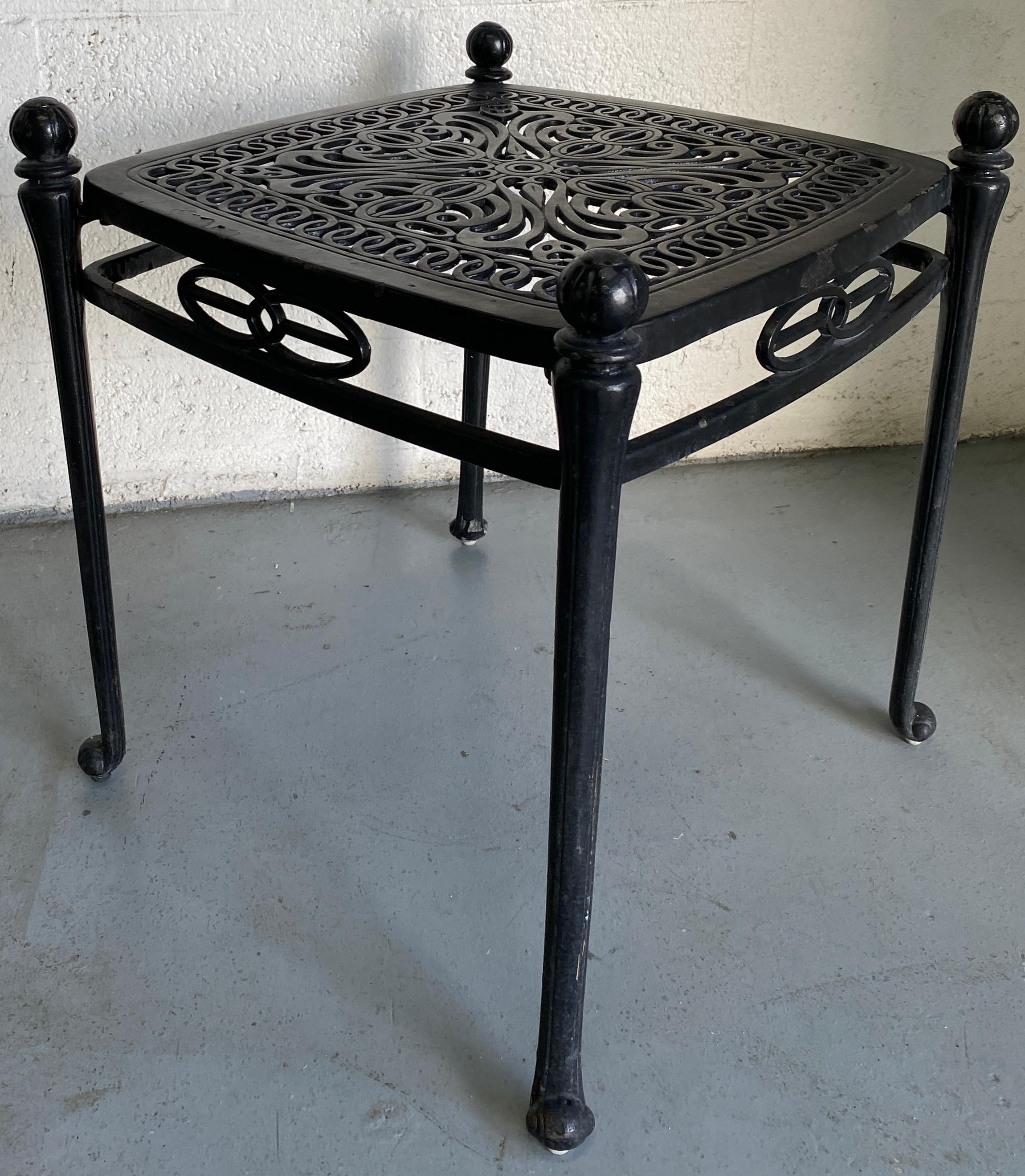A stylish vintage Russell Woodard style garden set. This wonderful cast aluminum garden furniture set features 2 lounge chairs or chaise lounges plus an intricately detailed Salterini style scroll square garden accent table set. 

The accent table