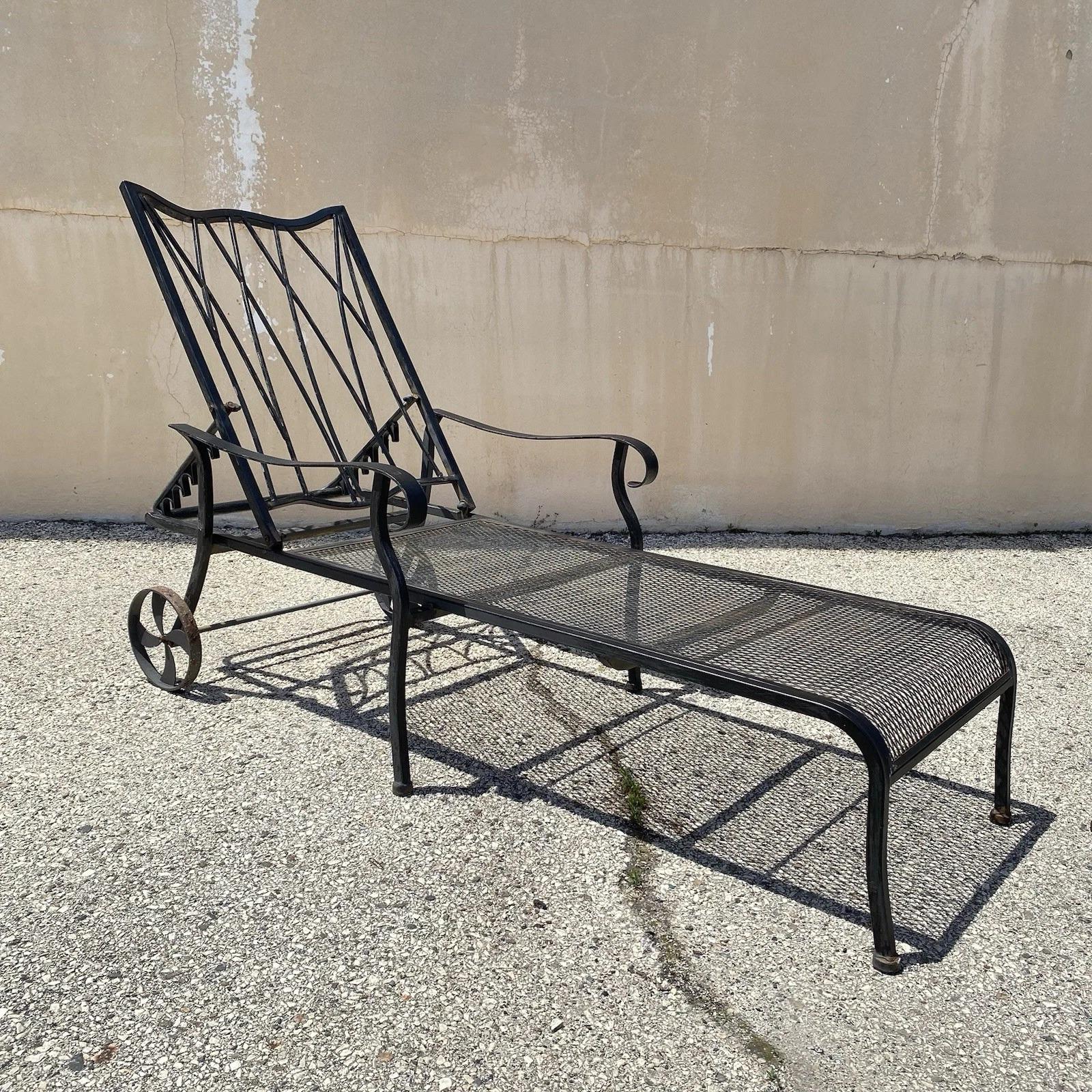 Woodard Style Wrought Iron Lattice Back Adjustable Garden Patio Chaise Lounge Chairs (one painted black and one green) - a Pair. Circa Late 20th Century. Measurements: 37