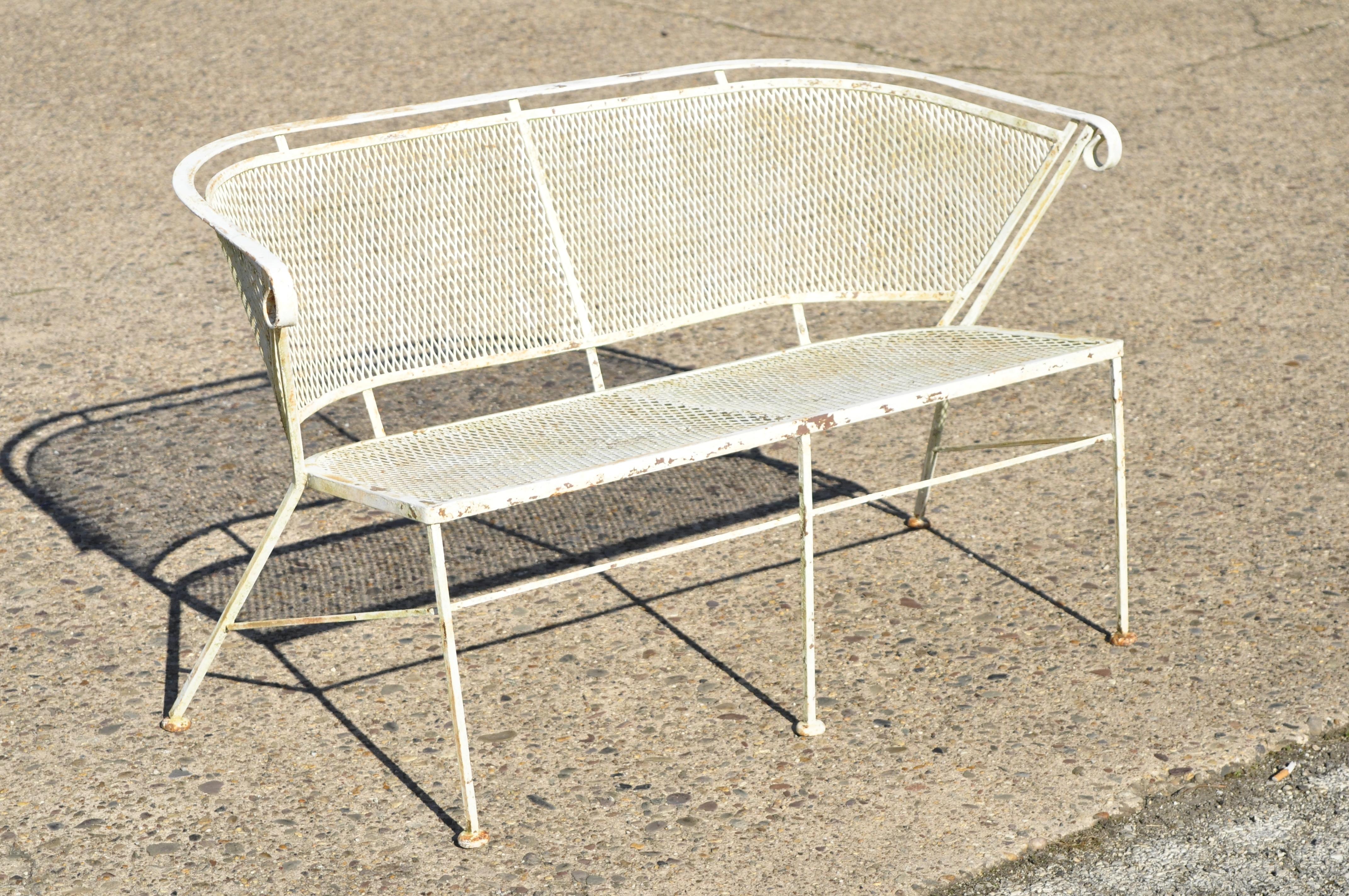 Woodard vintage midcentury wrought iron barrel back garden patio bench loveseat. Item features barrel back, metal mesh back and seat, wrought iron construction, very nice vintage item, great style and form, circa mid-20th century. Measurements: 29