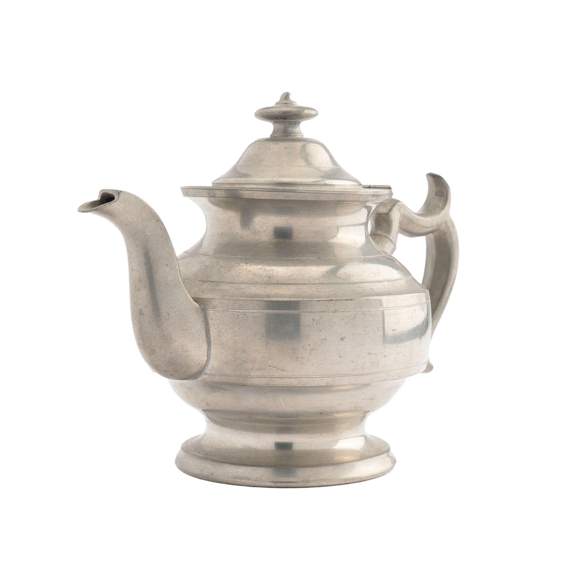 Pewter Holloware teapot from Woodbury Pewter. The teapot is an Academic Revival design after a Meridian, Connecticut model from 1820. Stamped on the underside with the maker's mark.
American, 1950 (design discontinued in 1952).
