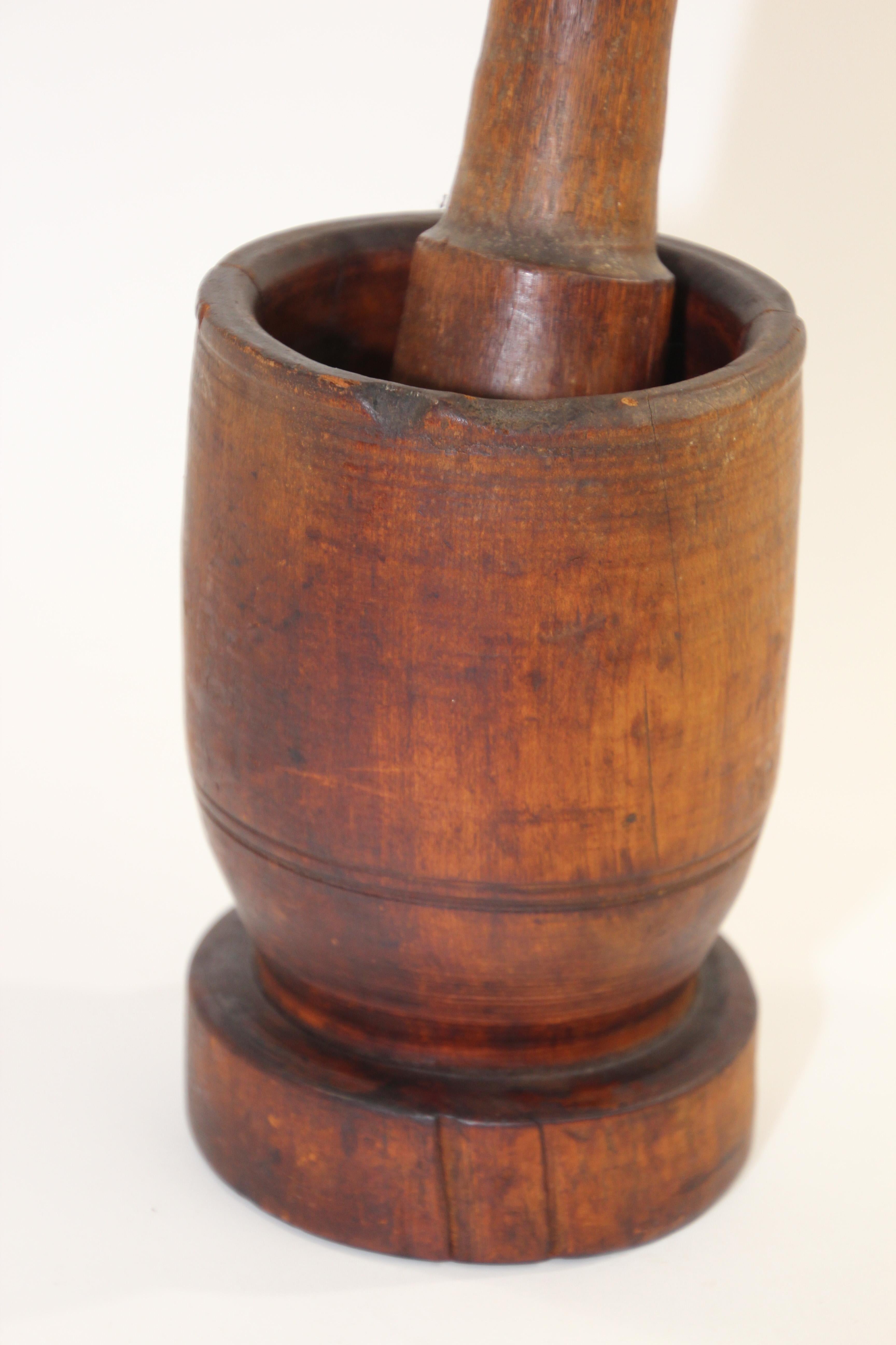 large wooden mortar and pestle