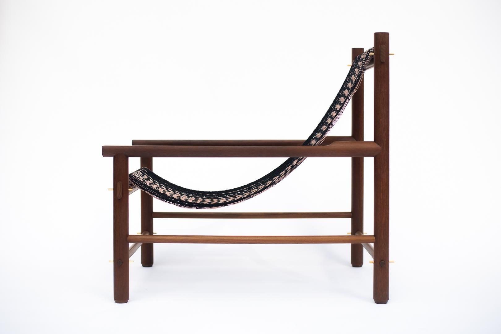 The Káan Armchair incorporates hammock weaving into a comfortable and functional design. This piece can be disassembled for ease of transportation and to minimize its carbon footprint. Small bronze bolts make assembly and disassembly easy, while