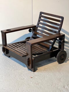 Wooden armchair with ottoman, attributed to Editions Asko 1965