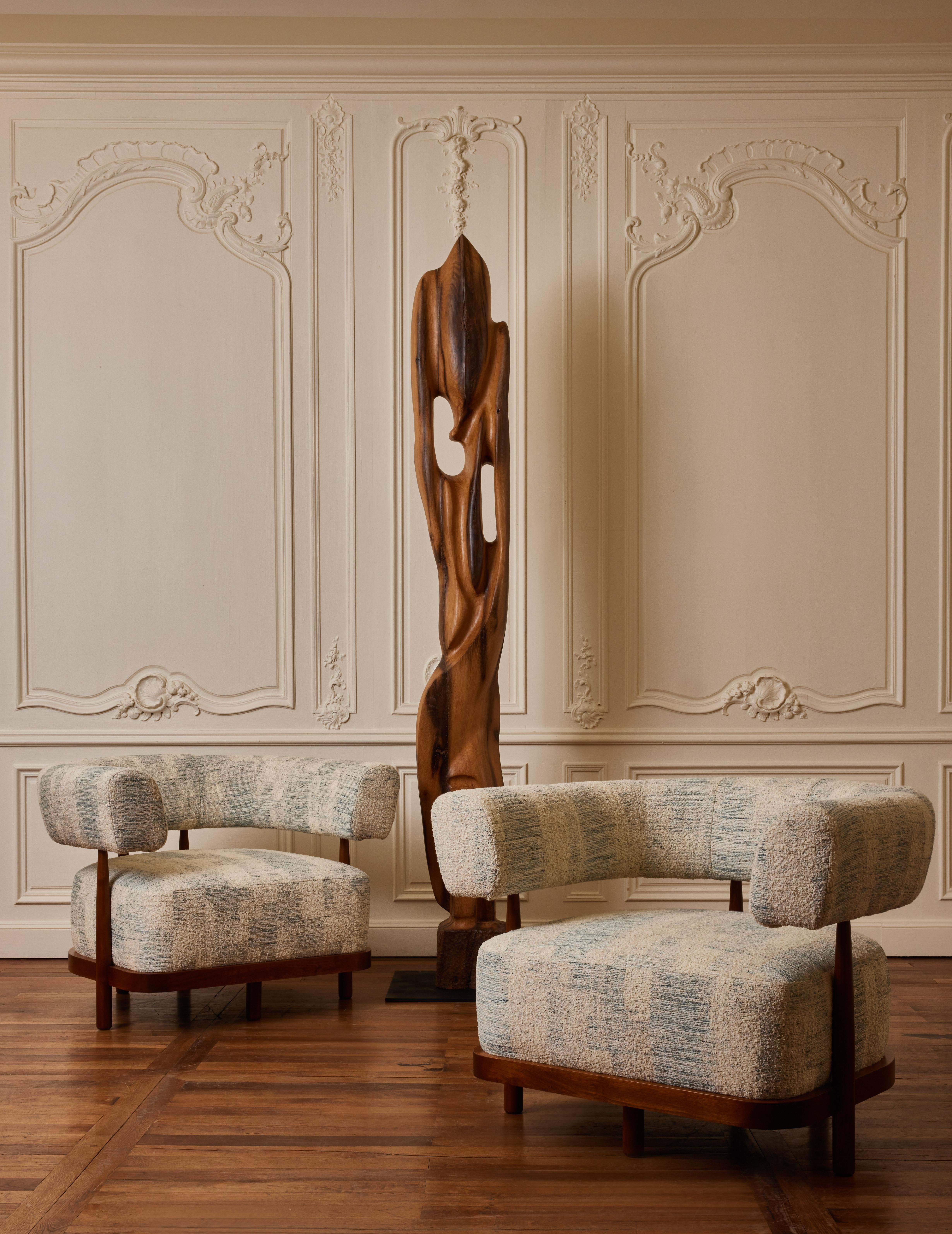 Pair of armchairs in wood upholstered with a fabric by Dédar.
Creation by Studio Glustin.
France, 2023.