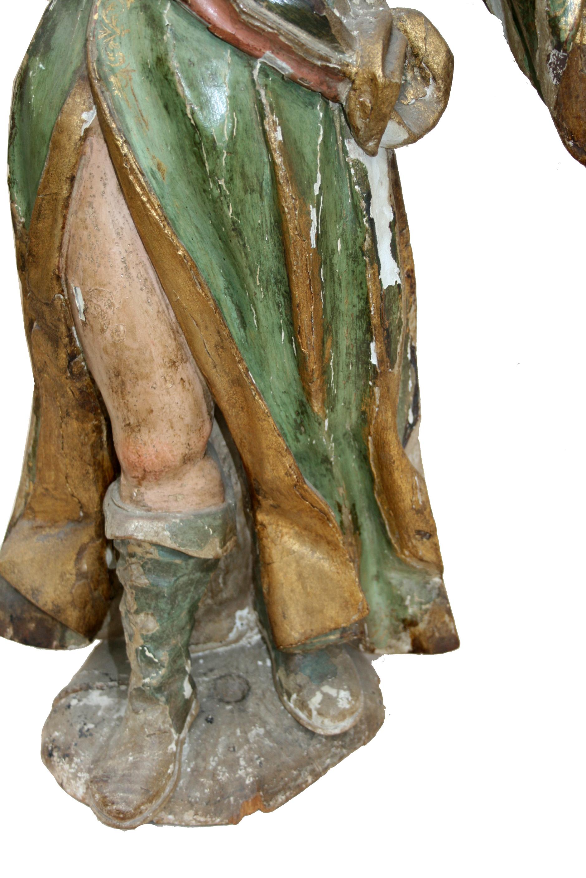 Wooden baroque sculpture of a saint made around 1630 For Sale 3