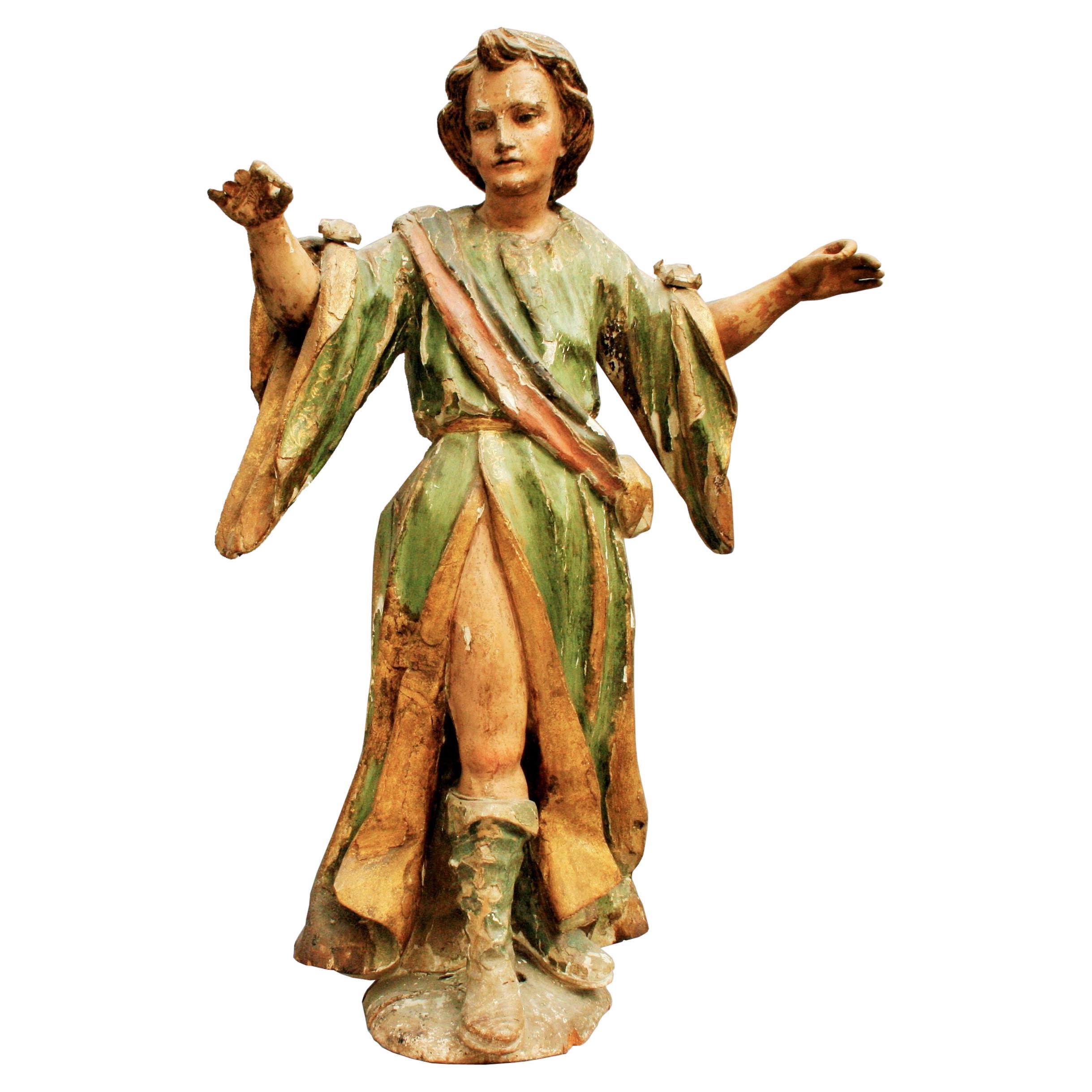 Wooden baroque sculpture of a saint made around 1630 For Sale