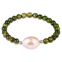 Wooden bead bracelet with pink baroque pearl and diamond encrusted silver beads