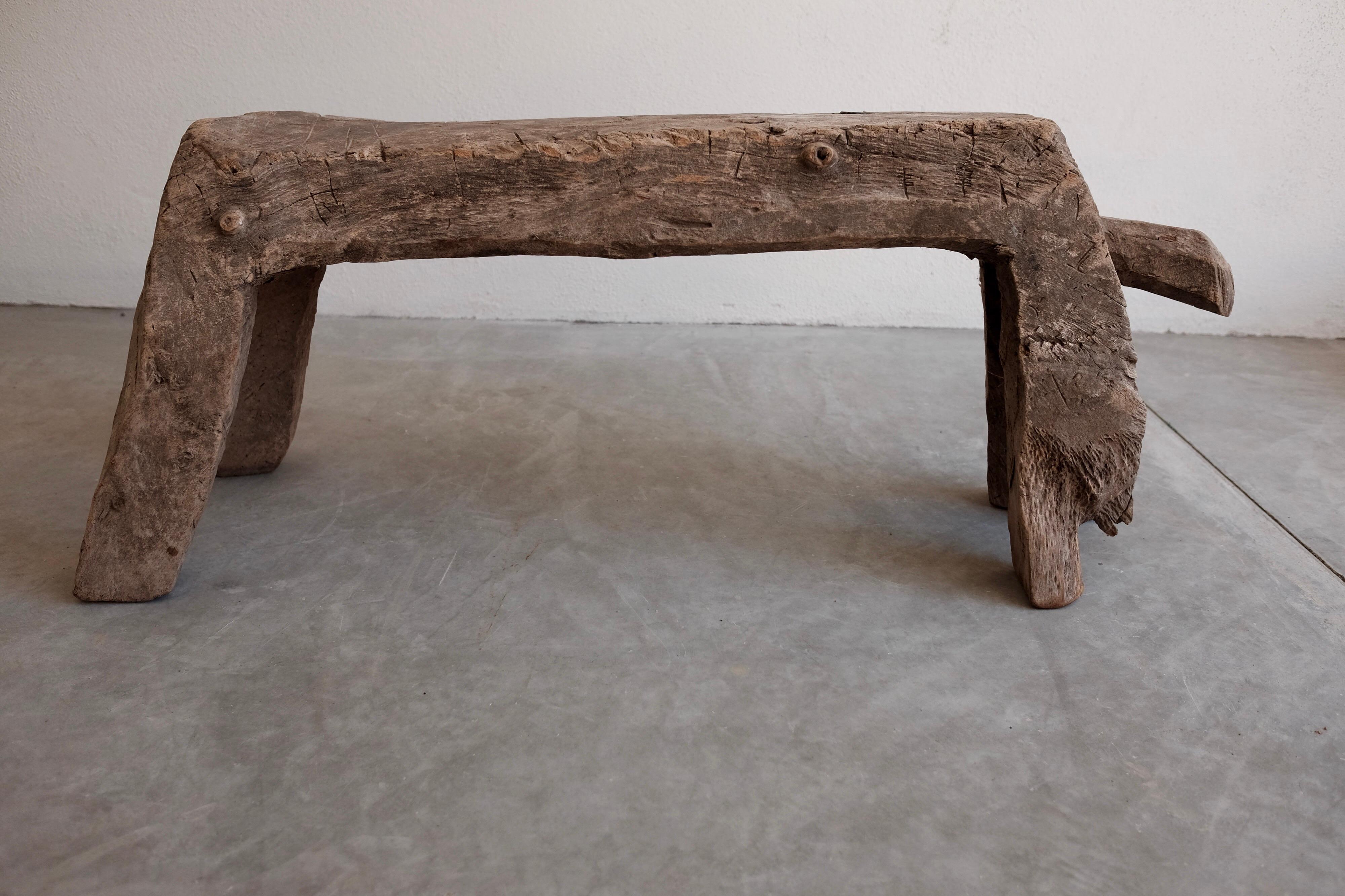 One-piece, primitive-styled, low mesquite bench from San Felipe, Guanajuato. Carved and formed by axe and chisel.