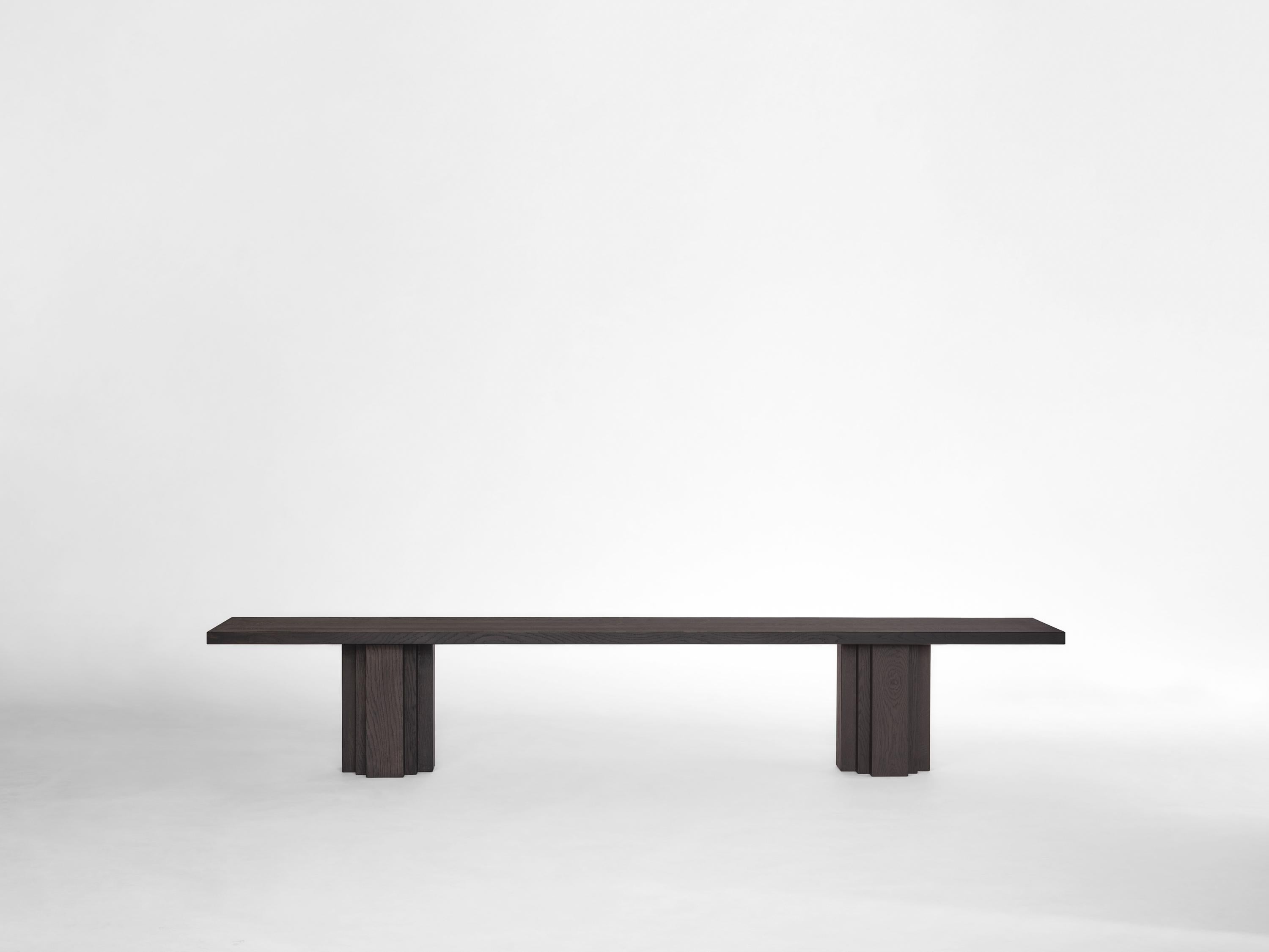 The Brut collection takes cues from Brutalism and Amsterdam School architecture. A balance of raw materiality and subdued forms with geometrically expressive detailing. The Brut bench functions as seating matching the Brut table or as an individual