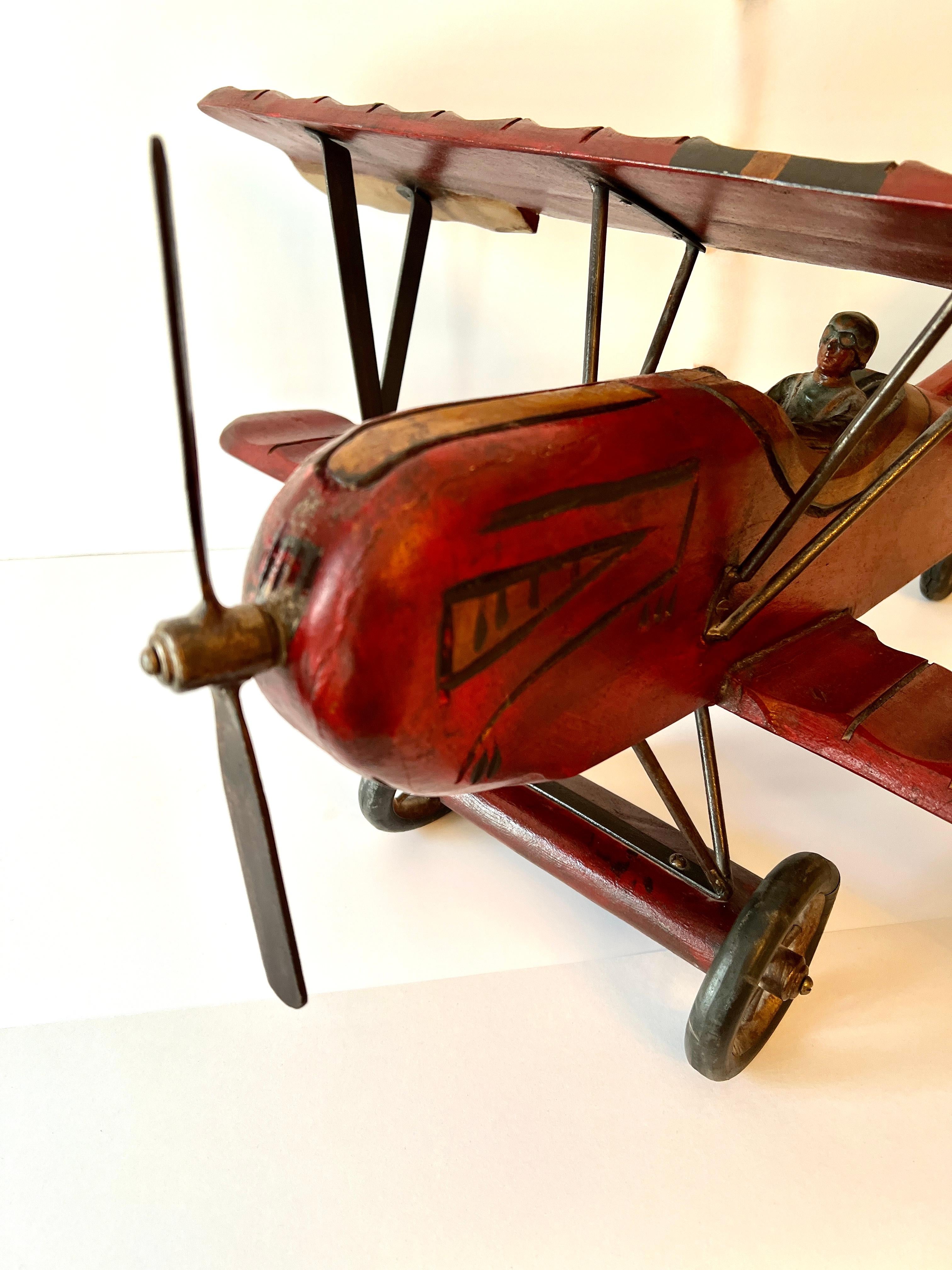 Wooden Biplane with Rubber Wheels, Metal Propeller  and Pilot In Good Condition In Los Angeles, CA