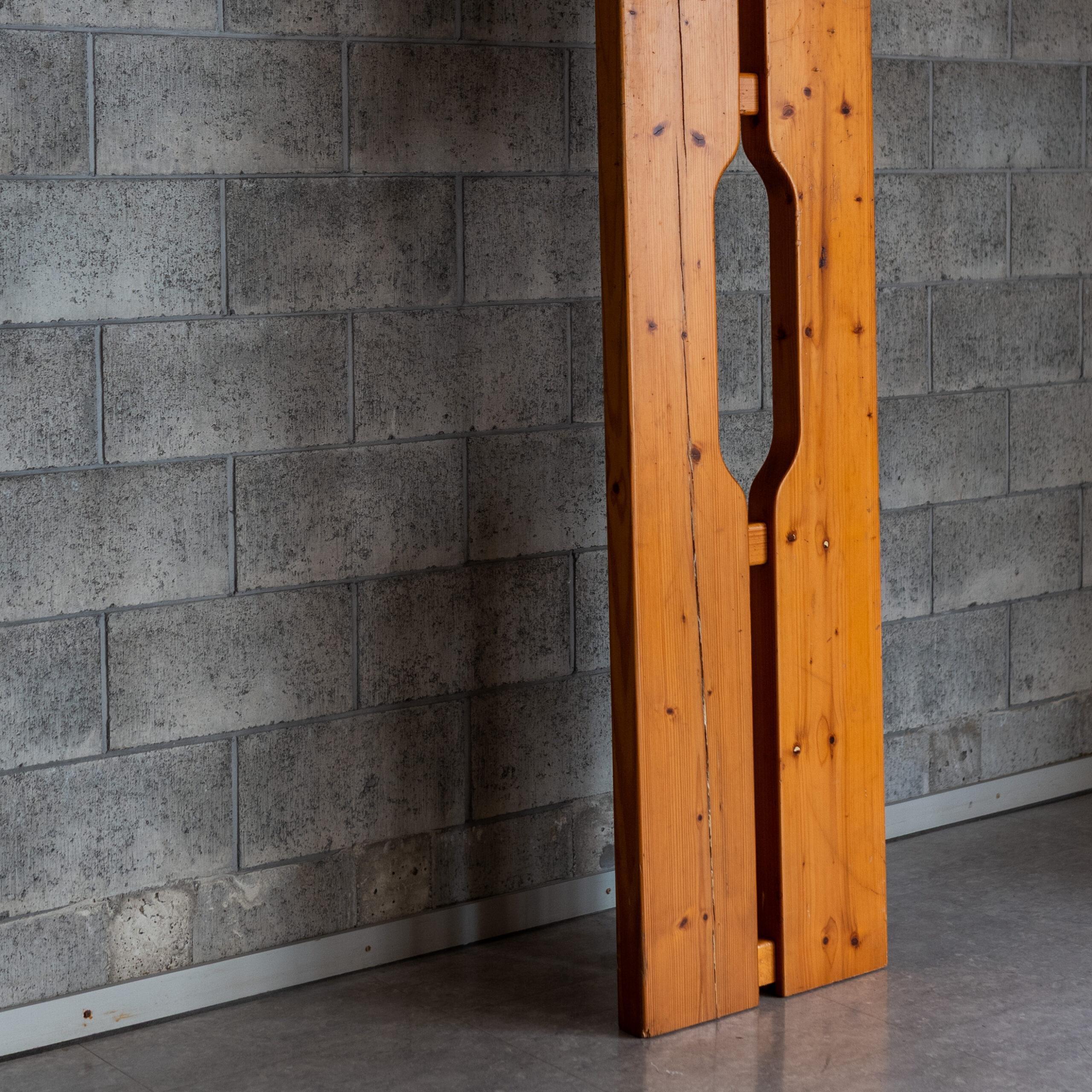 An architectural wooden panel designed by Charlotte Perriand for the Les Arcs. Crafted in solid pine with Perriand’s signature cut-out detail, this modular element was used as a partition within the mountain apartments, combining structural