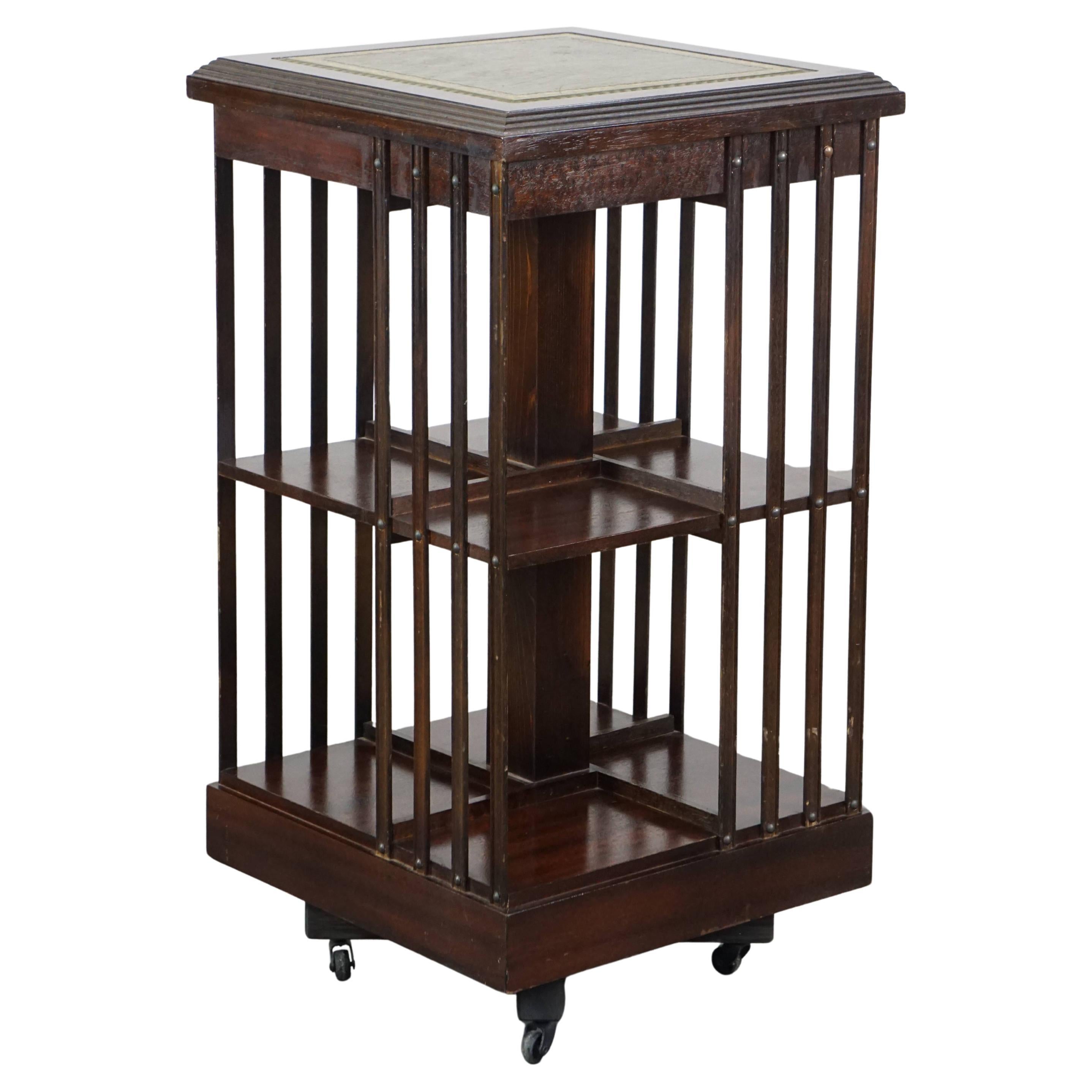 Wooden bookstand with green leather surface and on wheels in English style For Sale