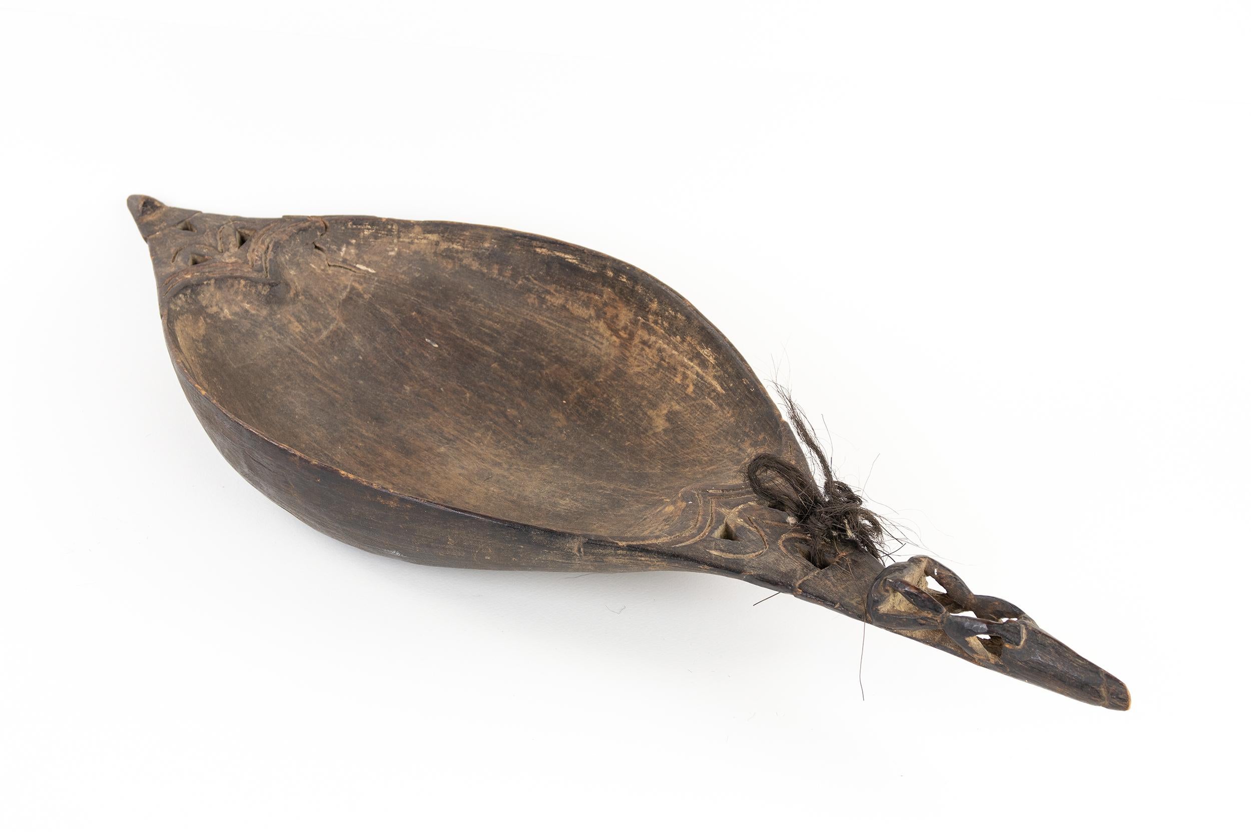 Its elongated oval shape recalls that of a canoe, it has two carved handles shaped like stylized animals.

This artwork is shipped from Italy. Under existing legislation, any artwork in Italy created over 70 years ago by an artist who has died