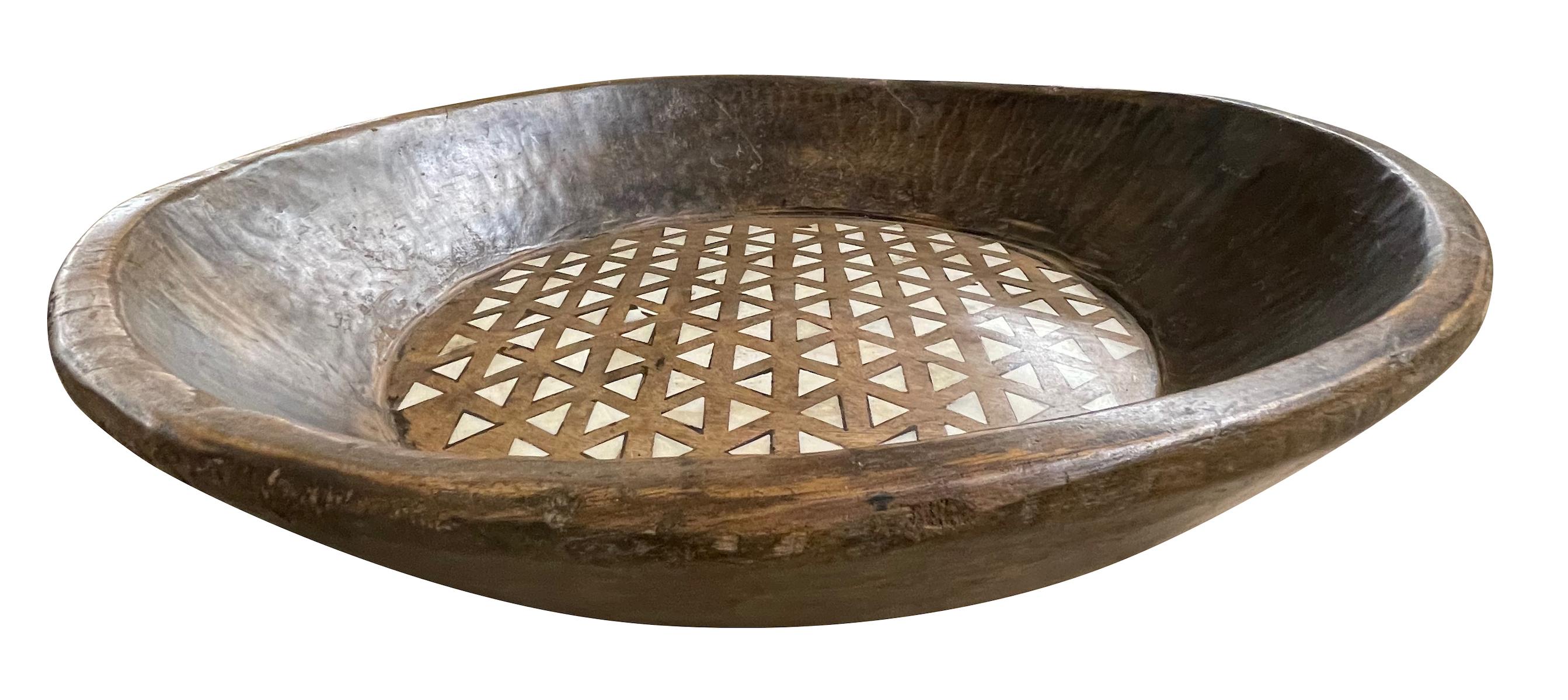 Contemporary Indian round wood bowl with triangular shaped bone inlay.
