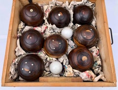 Box Containing 8 Lignum Vitae Wood Lawn Bowling Balls with 2 Kitties Early 1900s