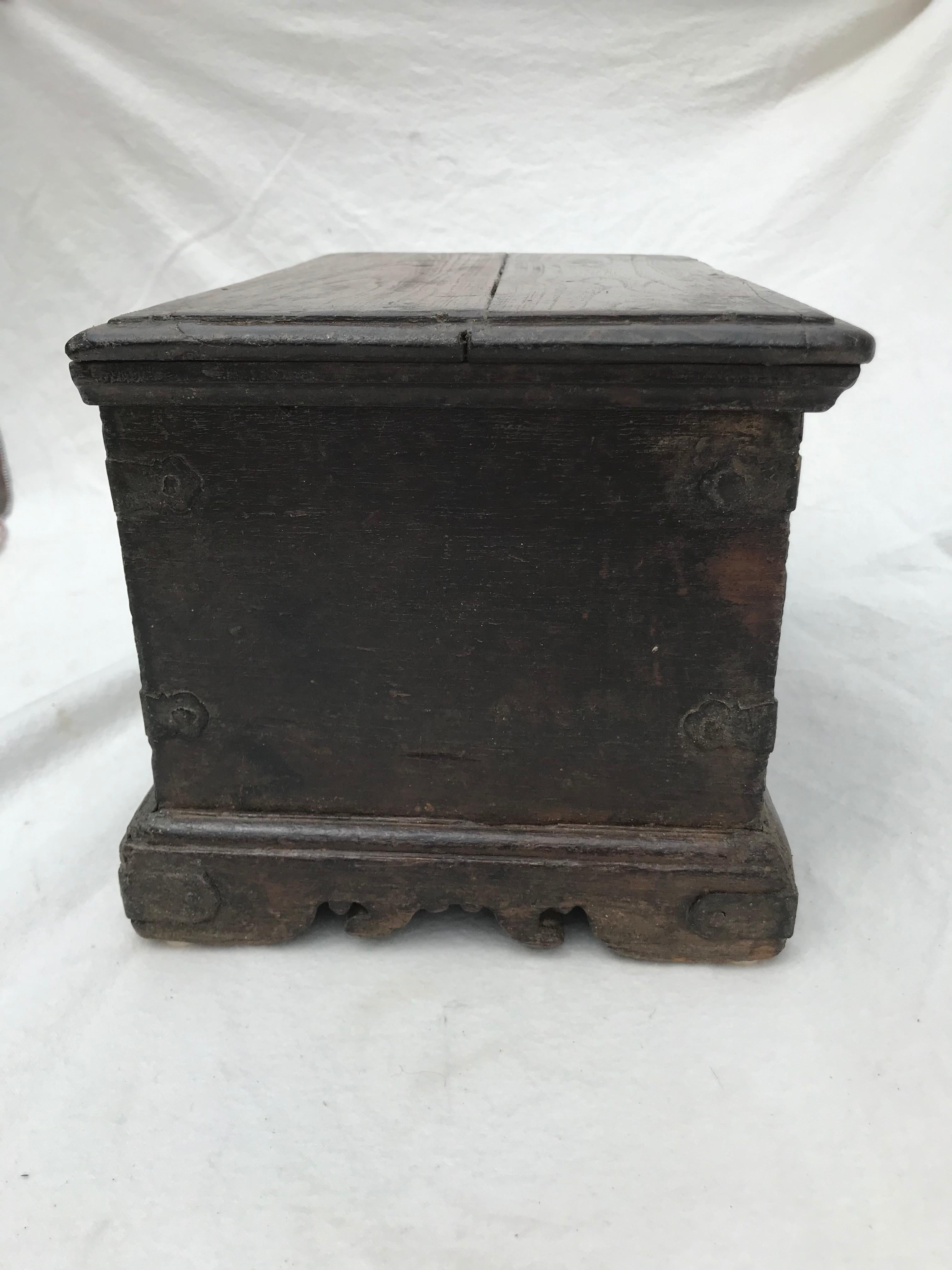 19th Century English Oak Coffer, circa 1850, having a beveled edge to lid, above case with interior divided into three compartments, on block feet with scroll cut apron. A Georgian style piece but likely slightly later.