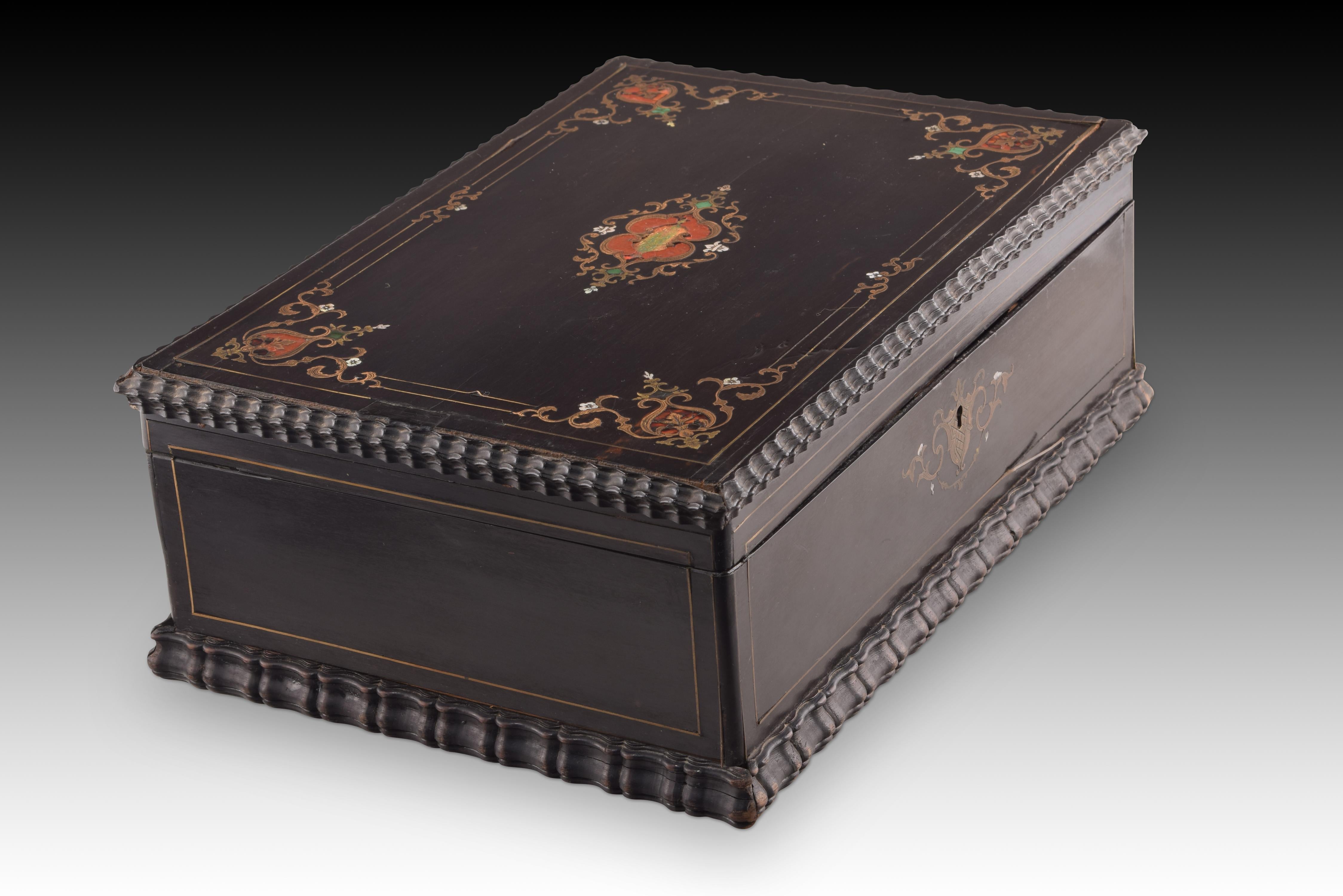 Box with metal marquetry. Wood, metal. Possibly French school, 19th century. 
Has damage. Requires restoration. 
Rectangular chest with a flat lid that has a dark wood interior decorated on the lid with two metallic lines, and a black exterior with
