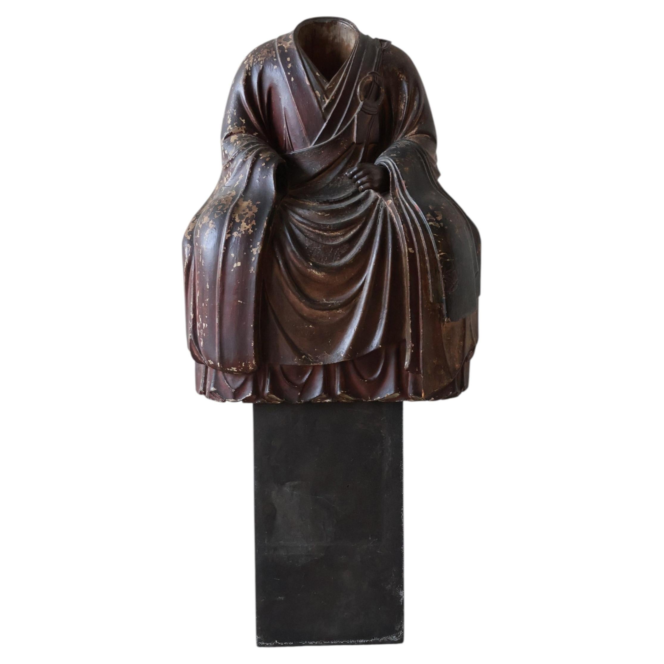 What are the statues in Buddhism called?