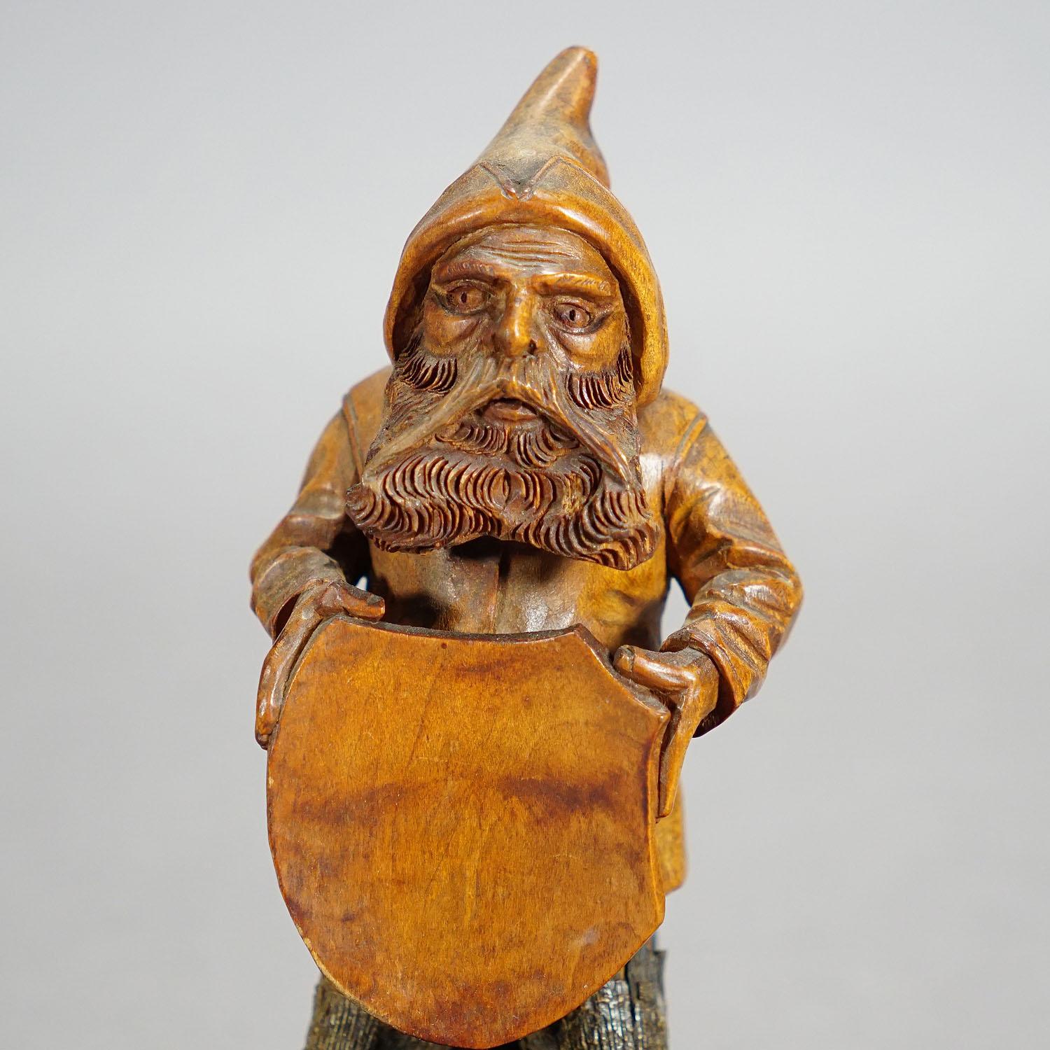 19th Century Wooden Carved Black Forest Dwarf Sitting on Three Stump