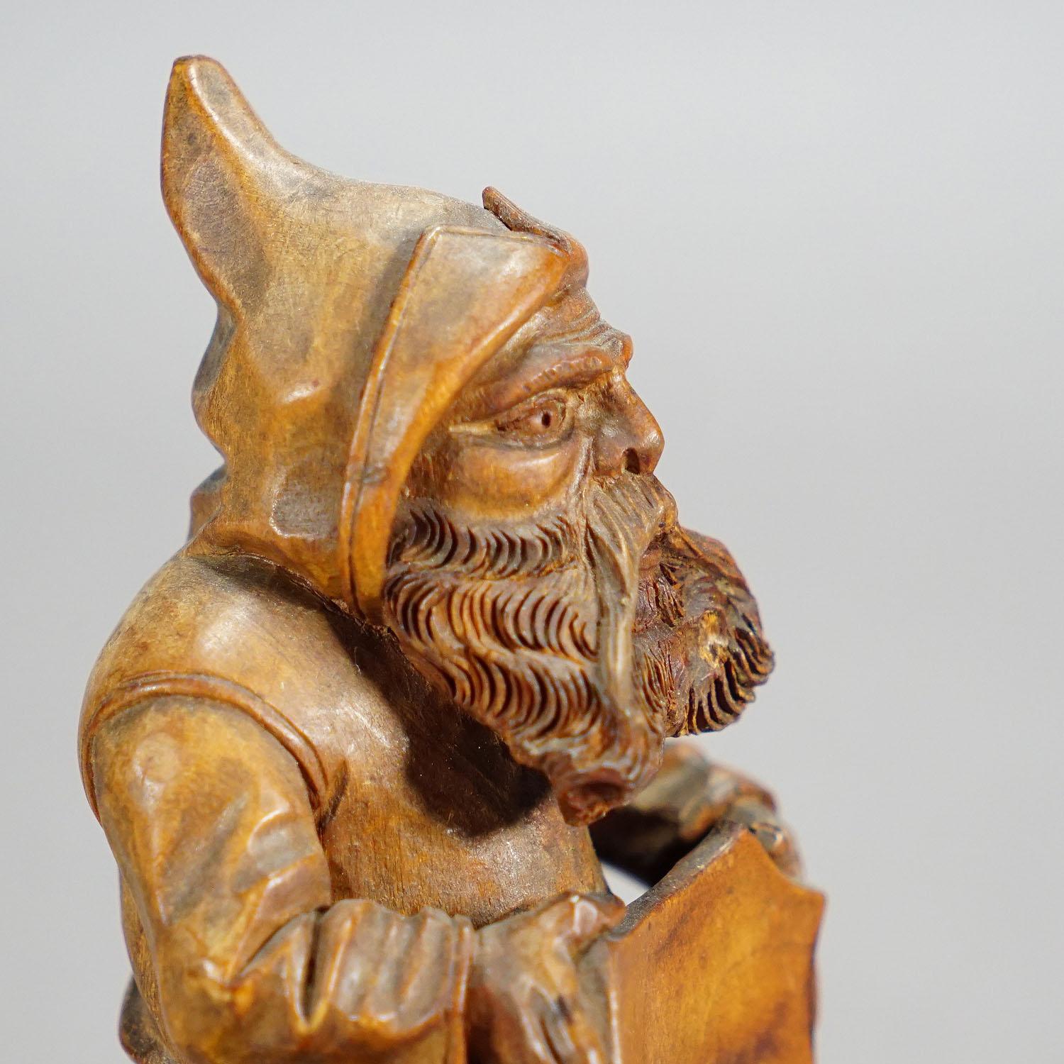 Wooden Carved Black Forest Dwarf Sitting on Three Stump 1