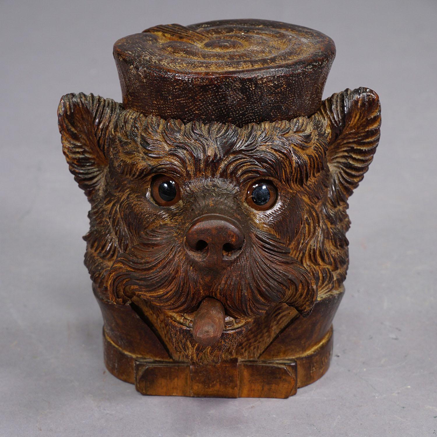 A Wooden Carved Black Forest Tobacco Box Terrier Head ca. 1900

A beautiful example of hand carved Black Forest work from the Victorian era, circa 1900. The tobacco box is carved in the shape of a terrier's head with a bow tie and upturned collar.