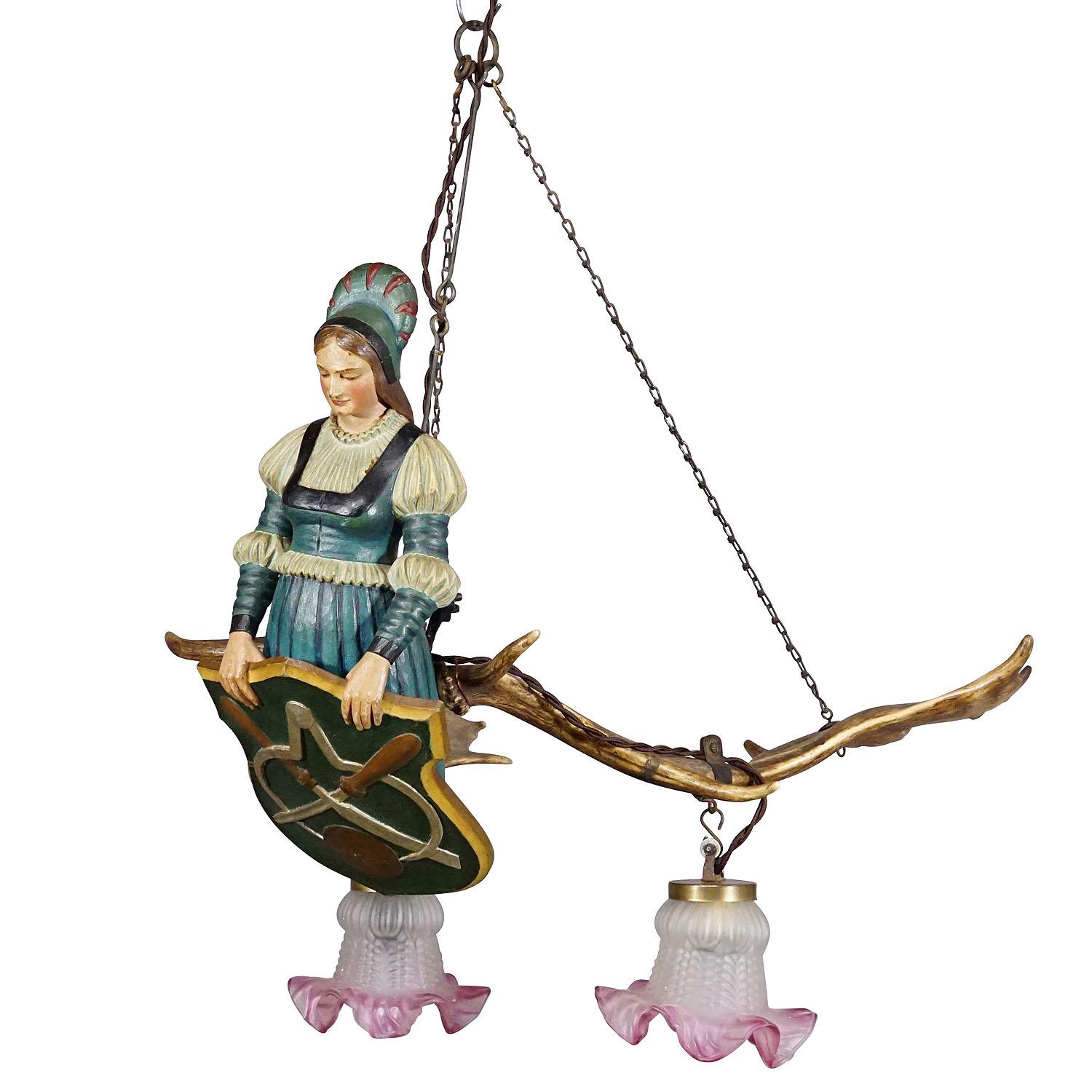 Wooden Carved Lusterweibchen of a Medieval Noble Lady ca. 1910
Item e7360
An antique chandelier - a so-called lusterweibchen - with a hand-carved and painted statue of a medieval lady holding a carpenter's guild sign. Mounted on a pair of large