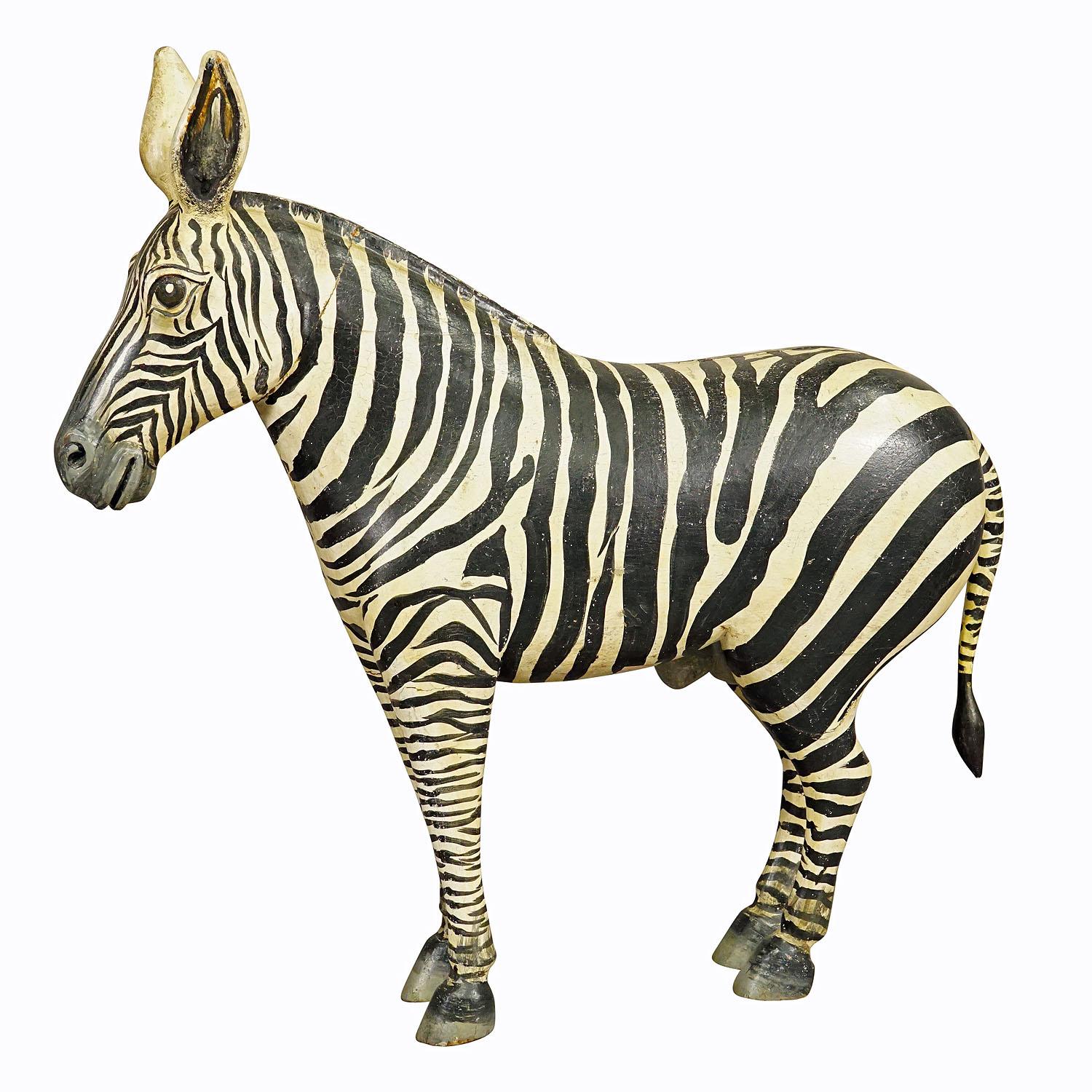 Wooden Carved Statue of a Zebra Handcarved in Germany ca. 1930s

An antique statue of a zebra. Made of wood, finely handcarved and handpainted with naturalistic details in Germany ca. 1930s. A very fancy home decoration. Good condition with minor