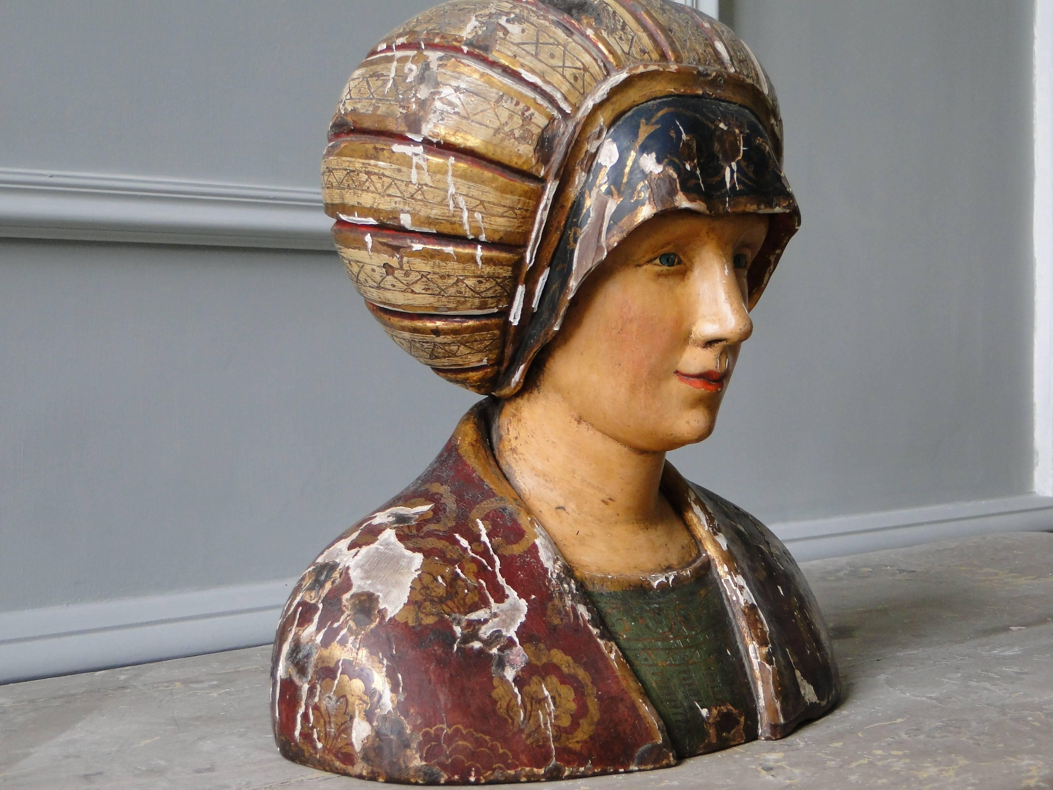 Wooden carved statueor bust from the 16th century, polycromed, French. After a medieval lady, label on bottom of statue.

 