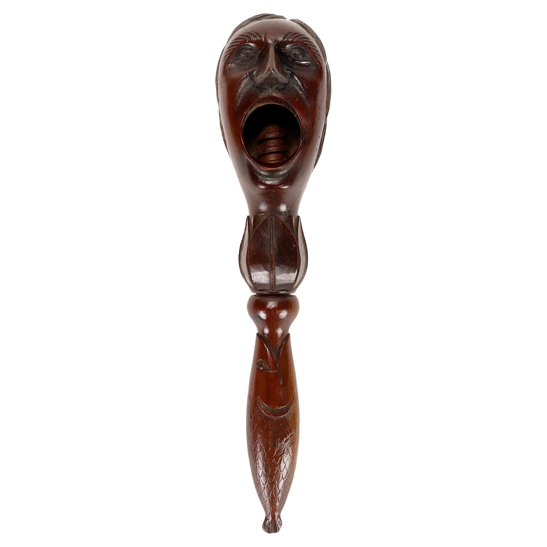 Wooden carvin nutckraker depicts a screaming man’s head, France 1880.  For Sale