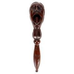 Wooden carvin nutckraker depicts a screaming man’s head, France 1880. 