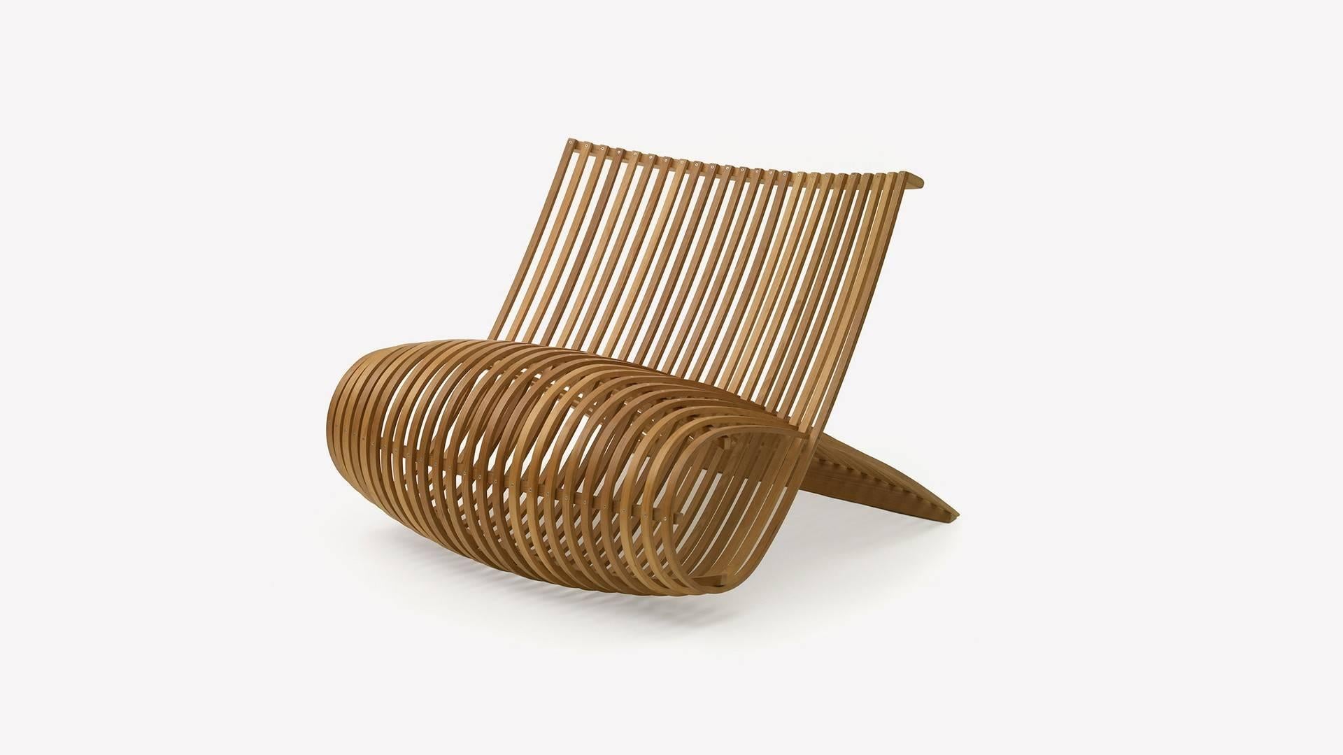 The Wooden Chair was designed in 1992 by Marc Newson for Cappellini. The chair is constructed of strips of bent natural beech hardwood with exposed fasteners. Due to its construction, the armchair has flexibility to allow for sitting comfort.