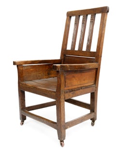 Wooden Chair with Carvings on Brass Casters