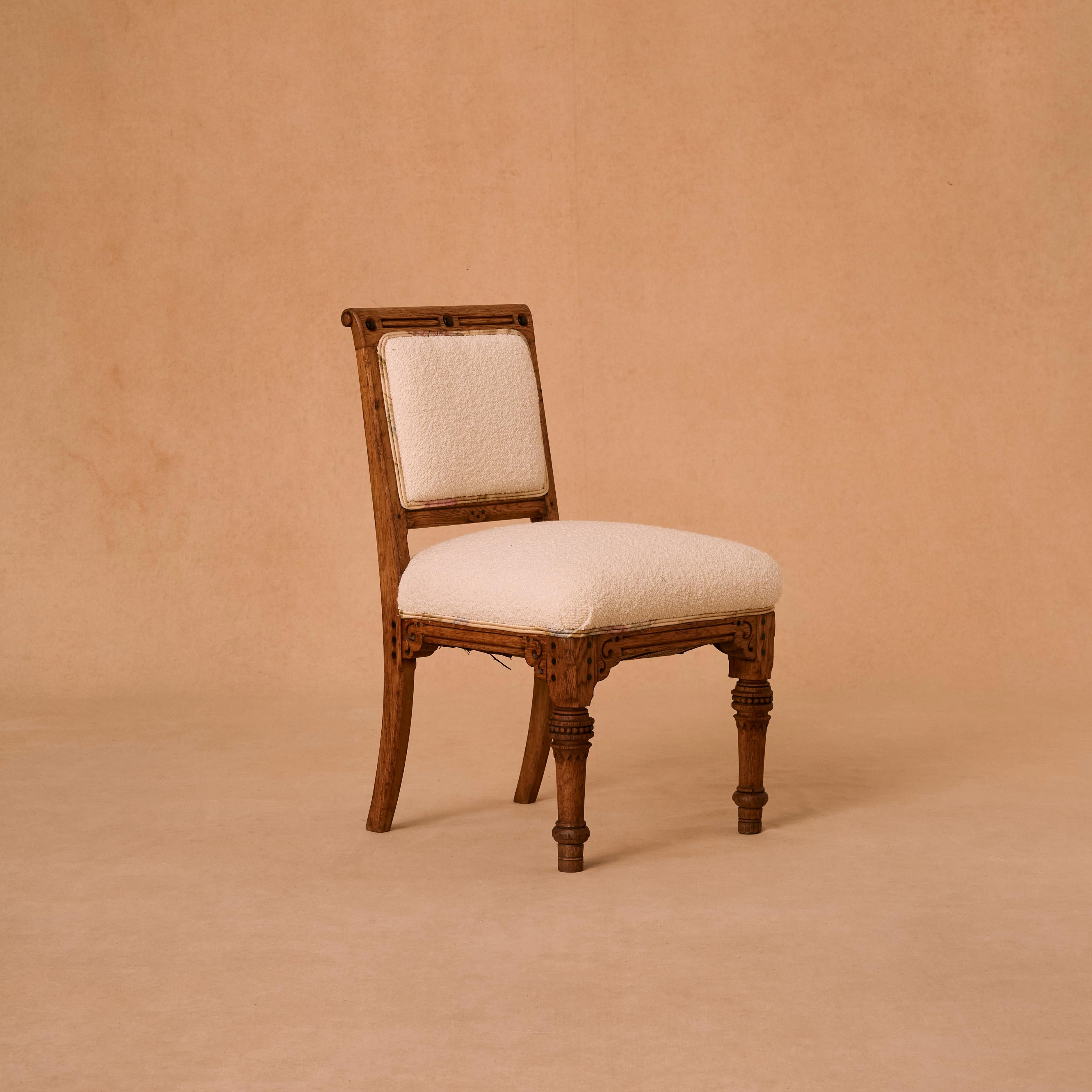 Antique chair wooden chair circa 1930s reupholstered in ivory boucle fabric.