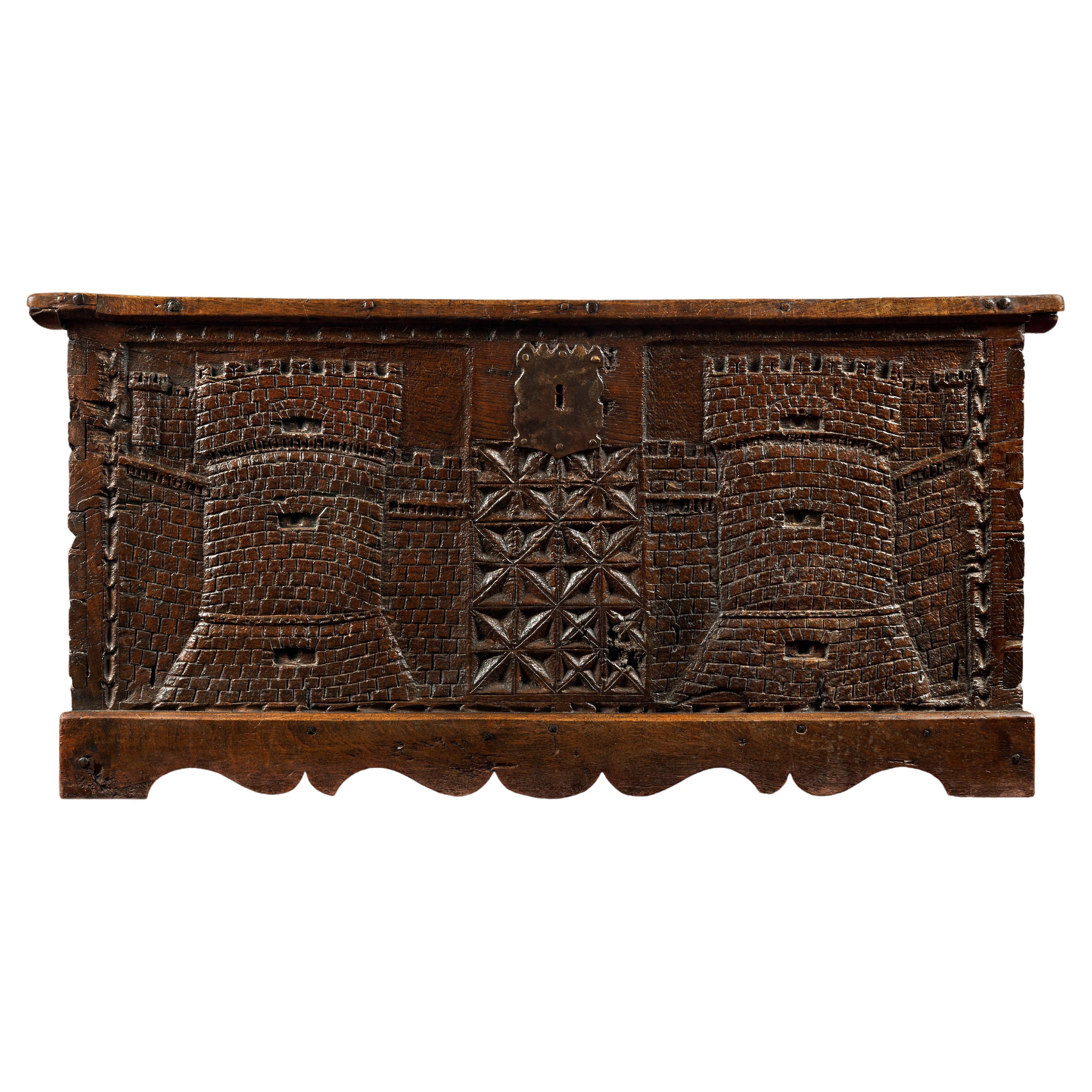 Wooden Chest Carved with Two Crenellated Towers For Sale