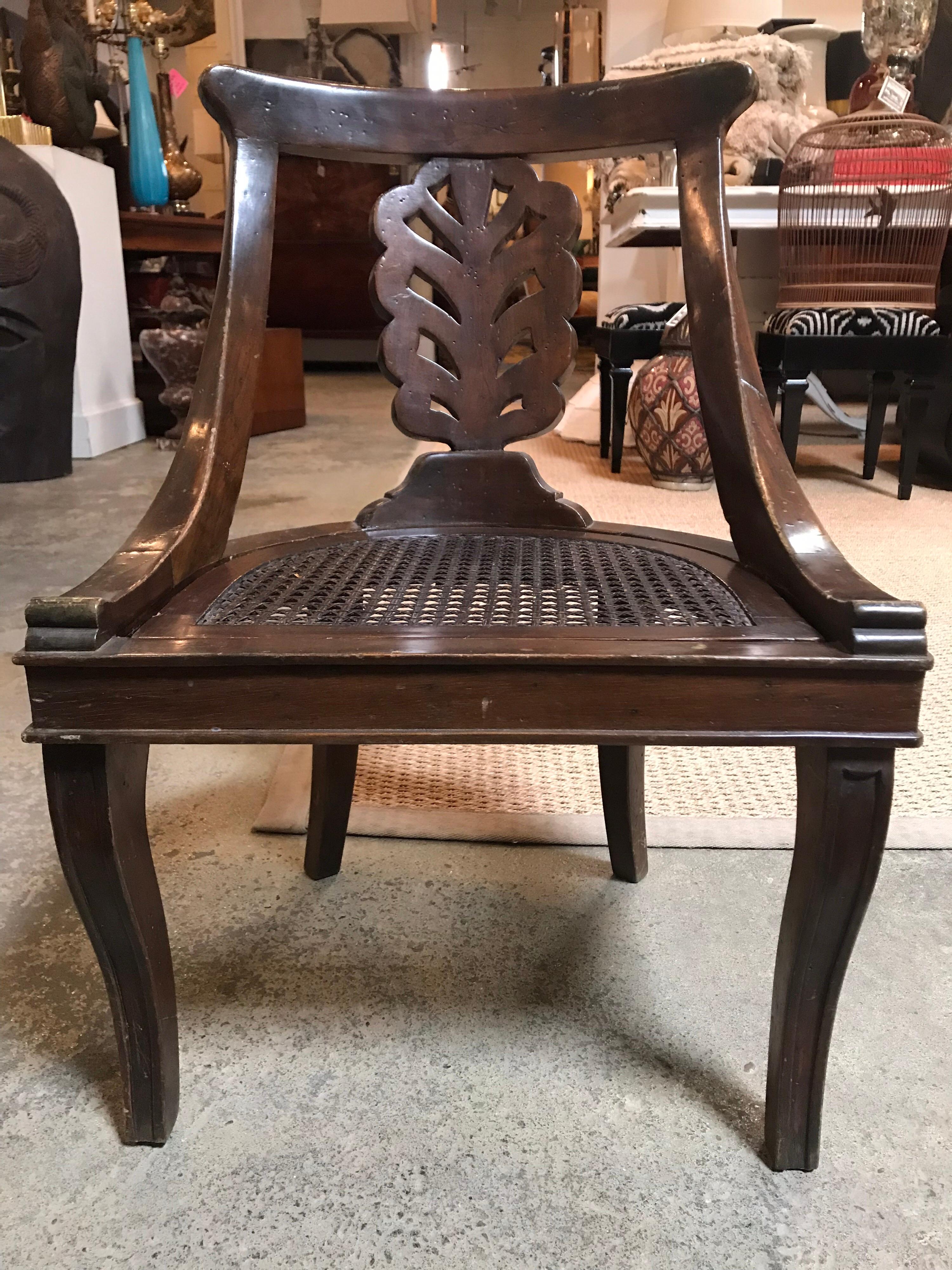 This wooden child's chair was made in Portugal during the 1940s. It is very short and has a removable seat pan, in case the original ever gets damaged.