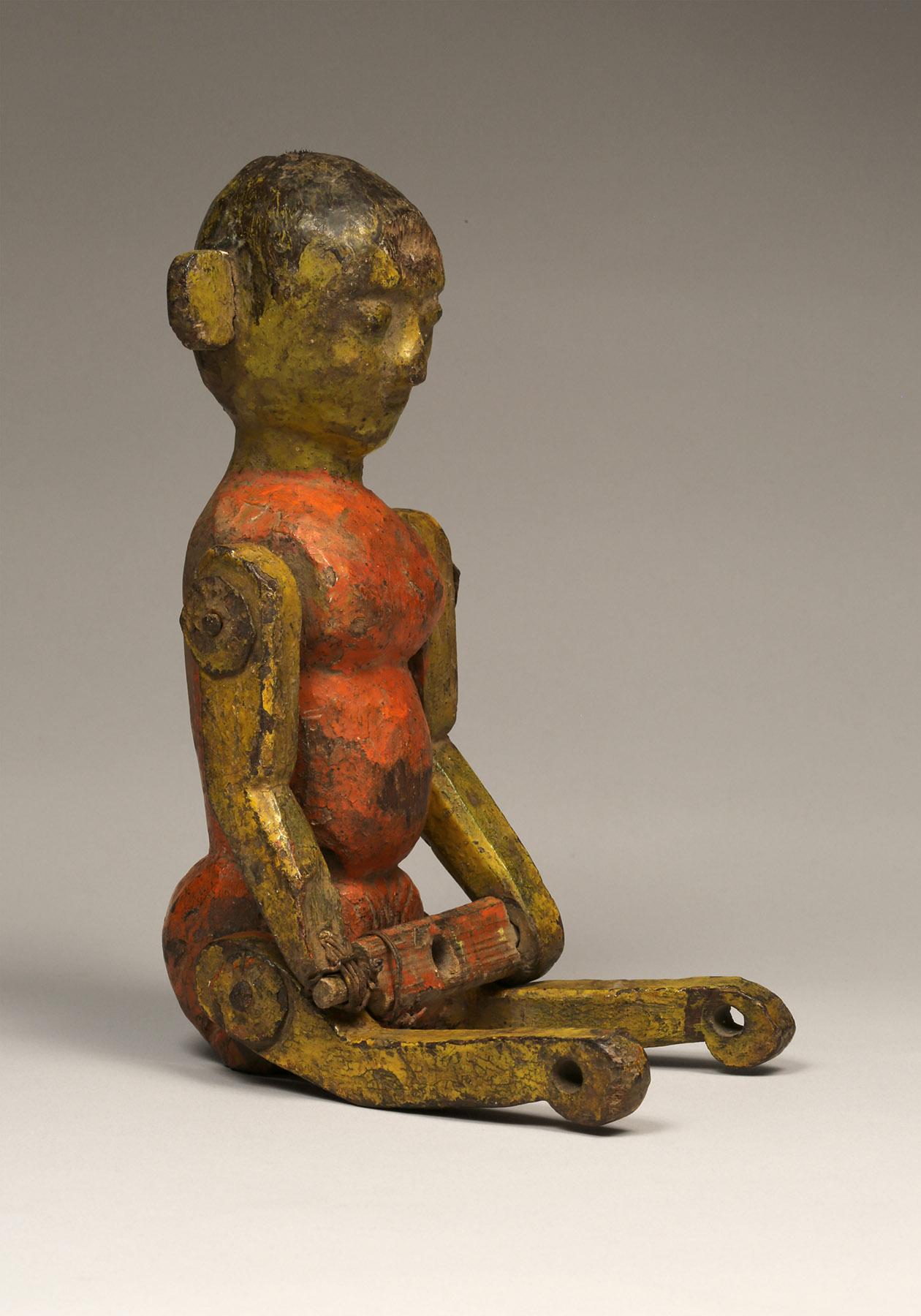 Wooden Child's Toy 
South India 
Ca 1920 
Wood, polychrome paint 
Measure: H: 11 in

Indian wooden doll possibly used as an oscillating pole toy.