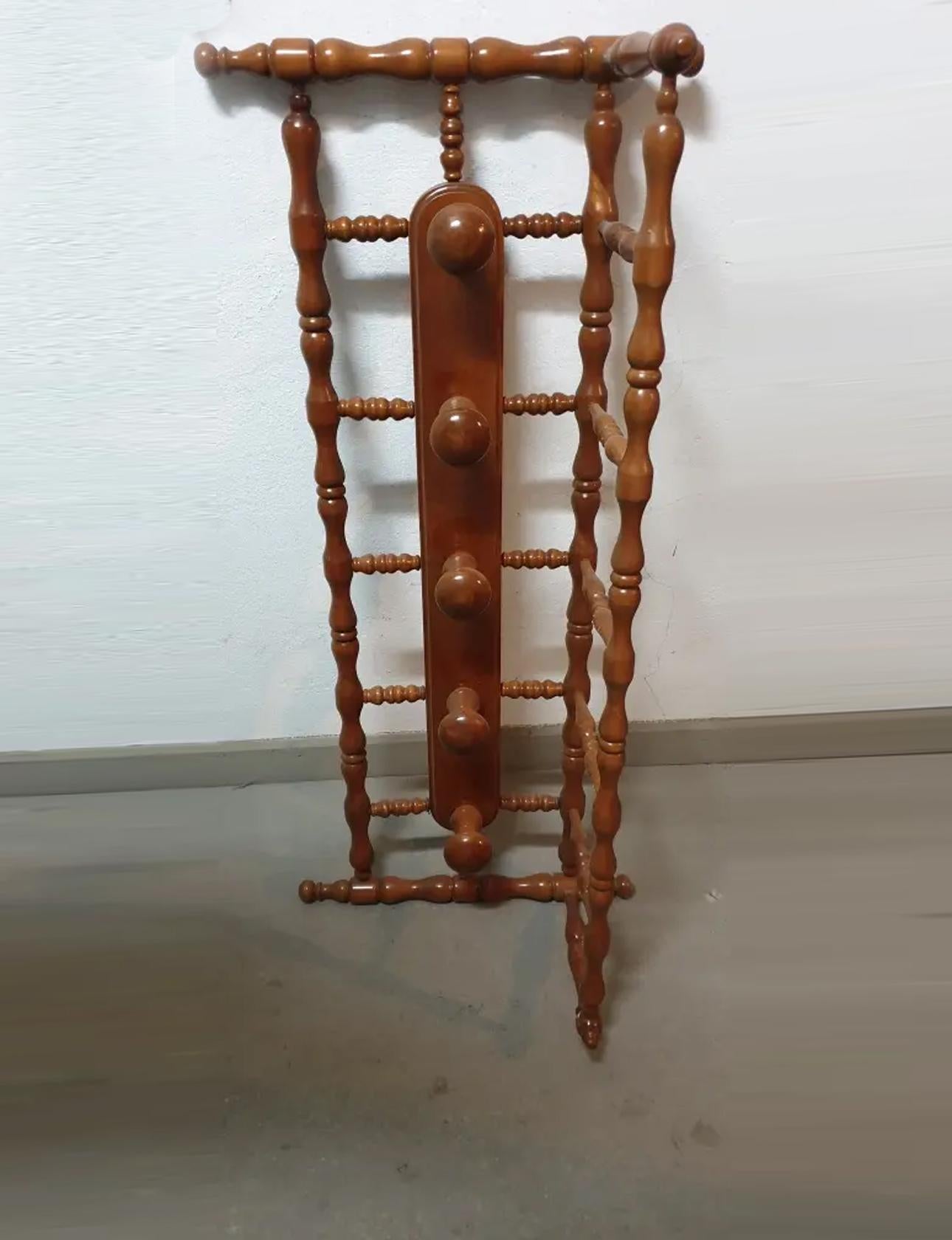 Large Wooden coat rack from the beginning of the 20th century

Perfect for entering your home to hang your bags coats
It has a top shelf to support the hats

Elegant and functional coat rack

It could also be used in the bathroom to hang