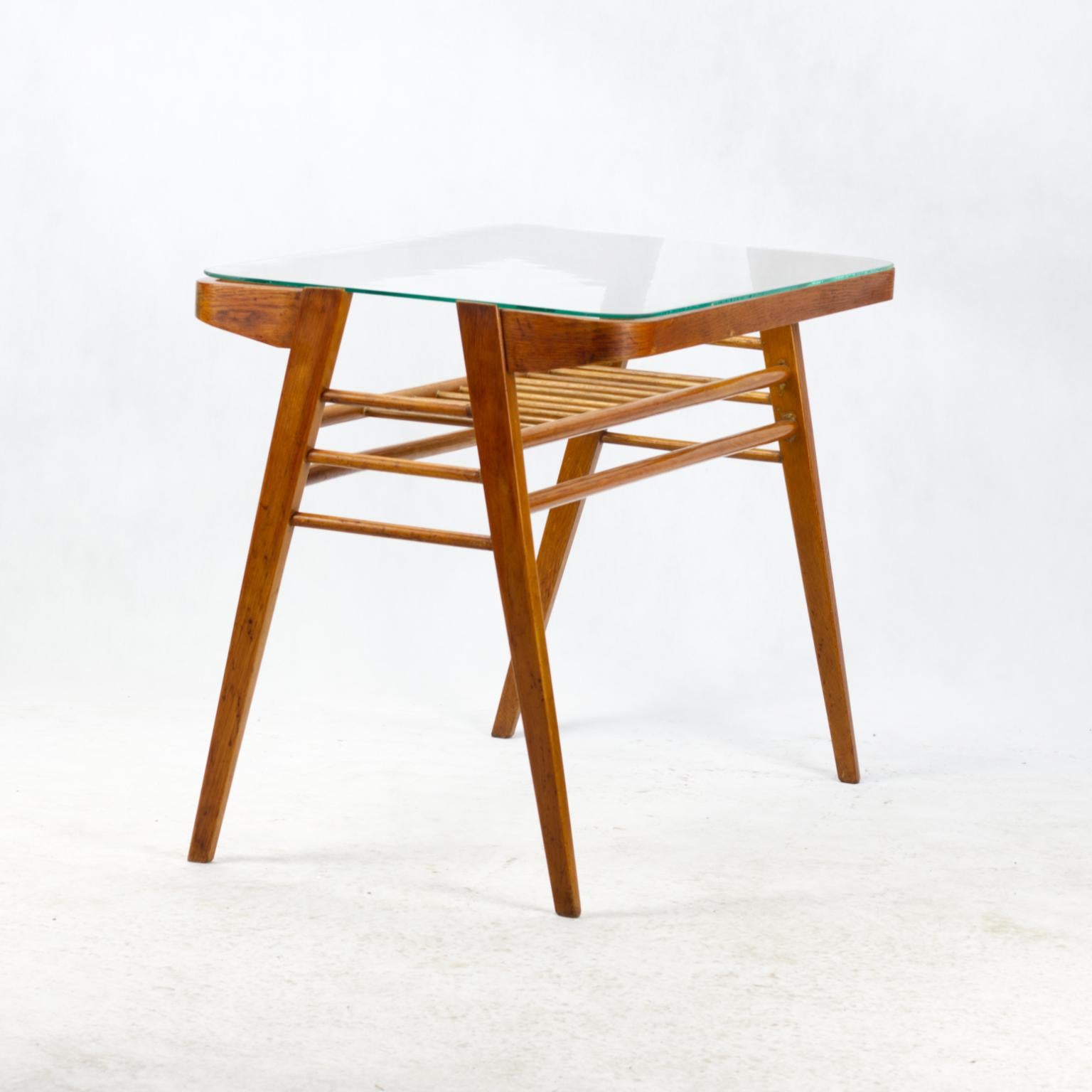 A wooden coffee table designed in the sixties by the Czech architect František Jirák. Jirák was a colleague of the famous designer Jindrich Halabala in the national enterprise Spojené umeleckoprumyslové závody in Brno, later he worked as an