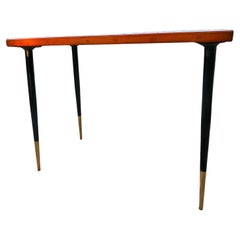 Wooden coffee table with iron legs. The wood has been painted.